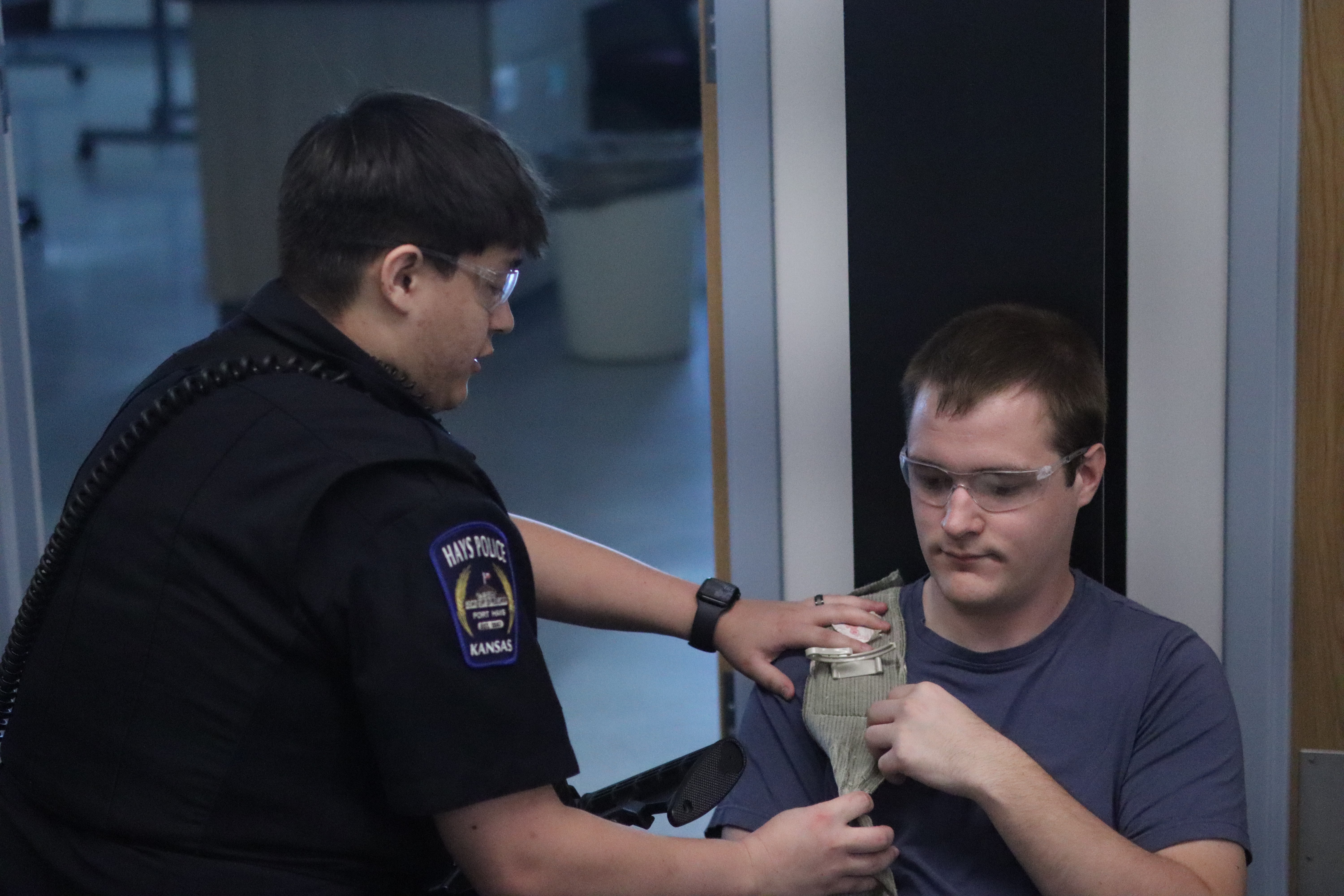 Hays Police Department officers train alongside simulated victims and actors during an active shooter exercise at Hays High School.<br>