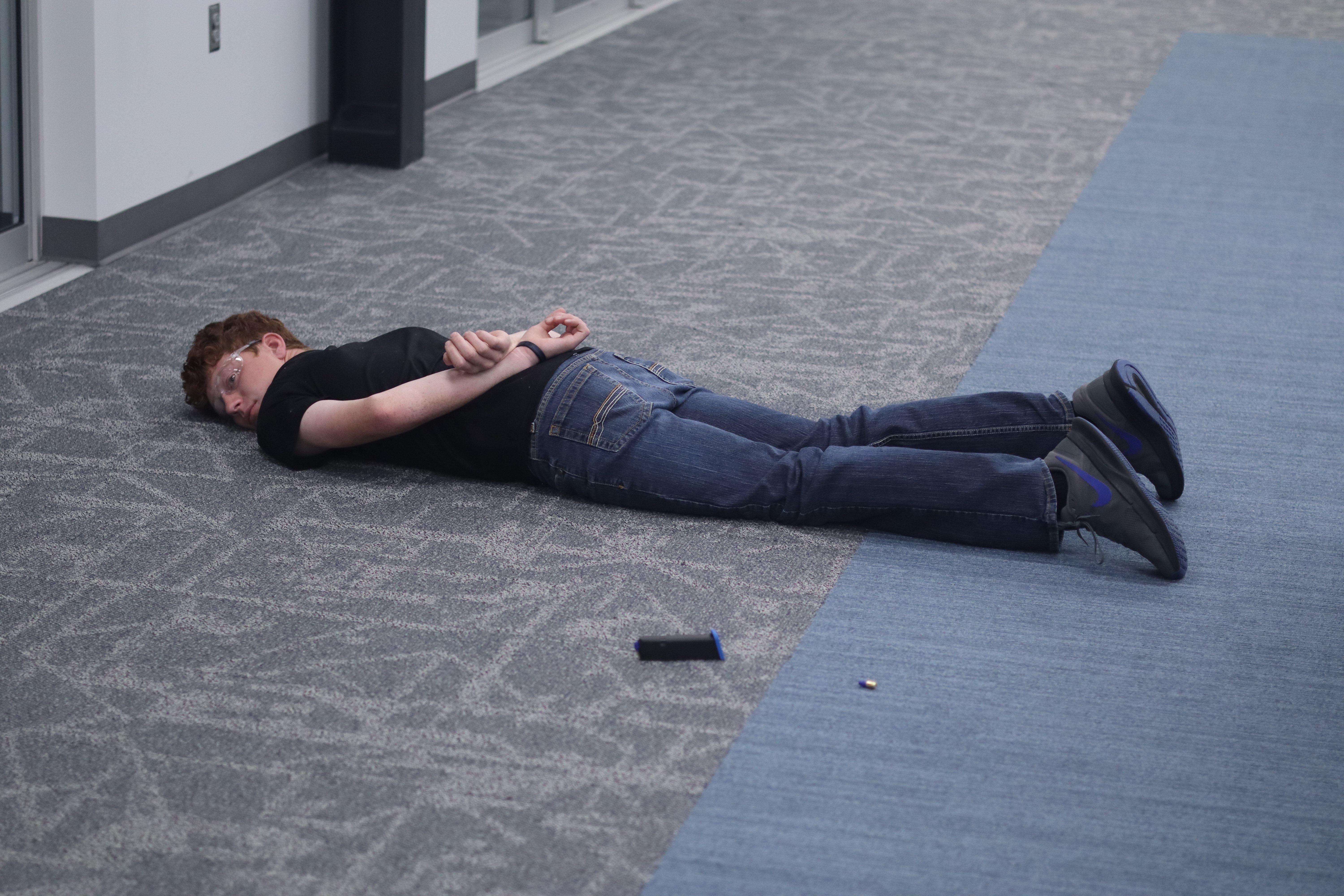 Hays Police Department officers arrest a simulated suspect during an active shooter training exercise at Hays High School.&nbsp;