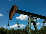 Price of oil again nears $100 a barrel, stocks drift lower