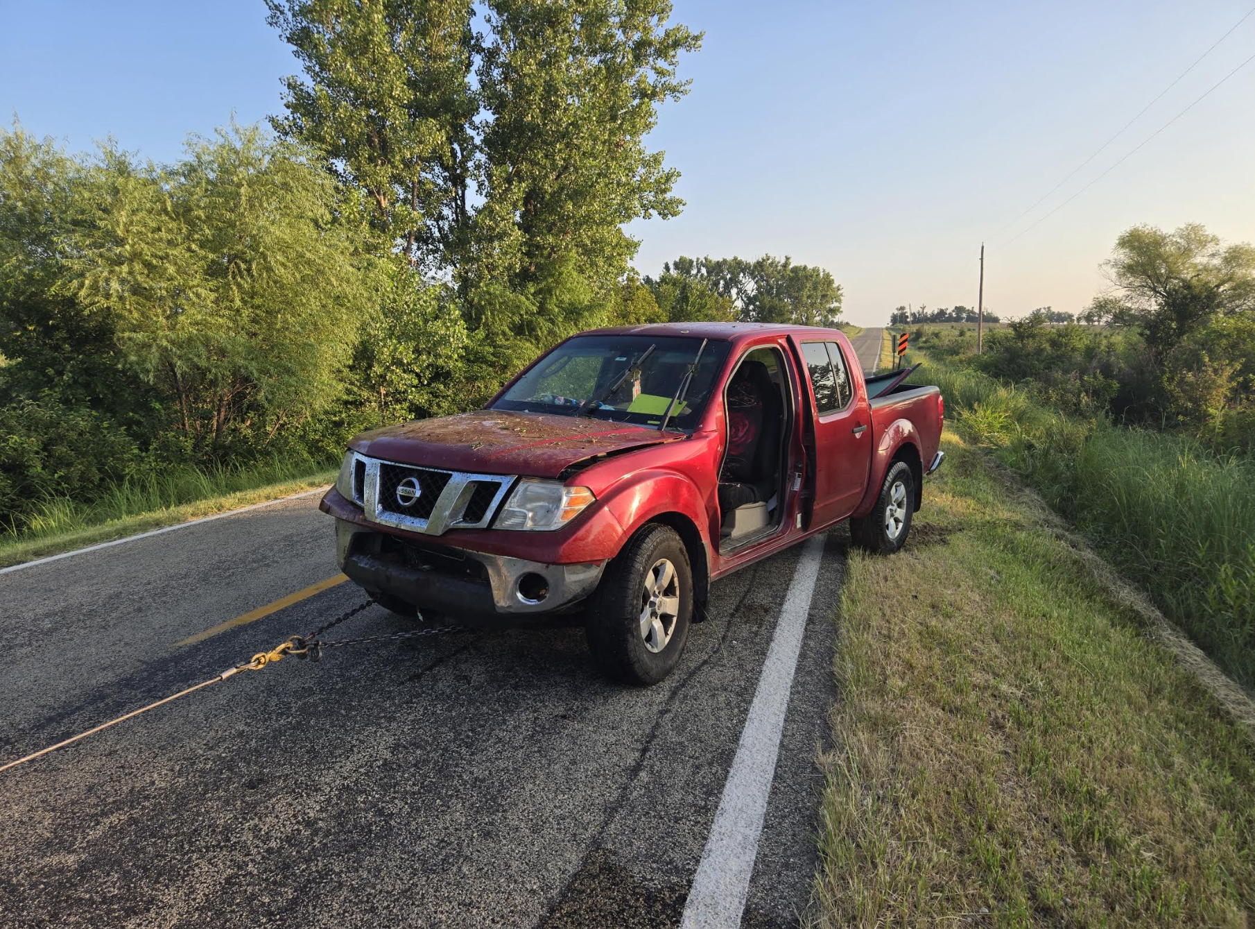 Single-vehicle crash of red 2009 Nissan Frontier pickup on July 25 - Photo, Saline County Sheriff's Office