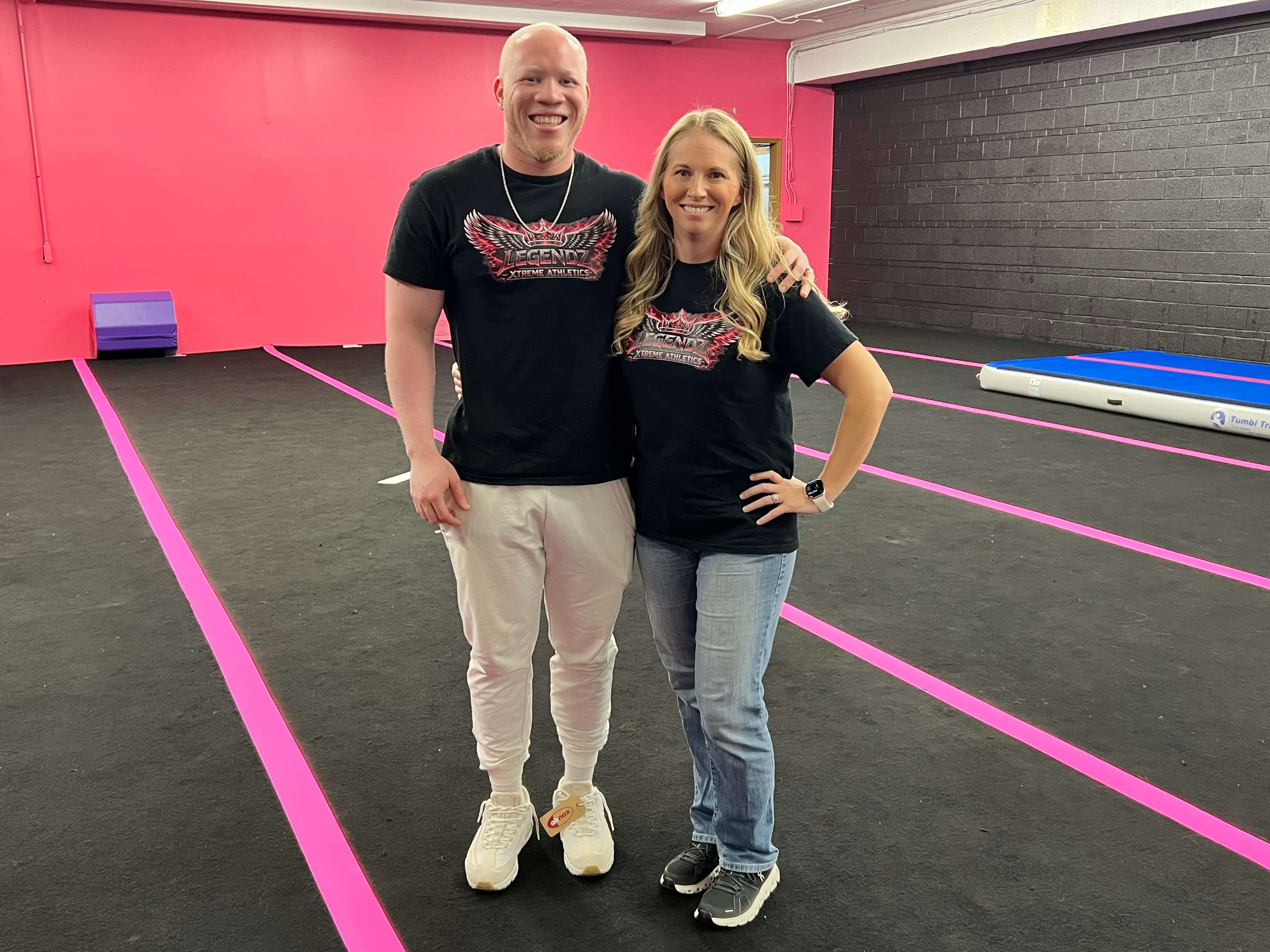 EJ Bennett, left, and his wife, Sierra Bennett, stand inside Legendz Xtreme Athletics, 722 E. Fourth Ave. in Hutchinson. The couple recently opened the gym, which offers cheer, tumbling, gymnastics, dance and other athletic programs for children and adults. (Hutch Post Photo/Sean Boston)