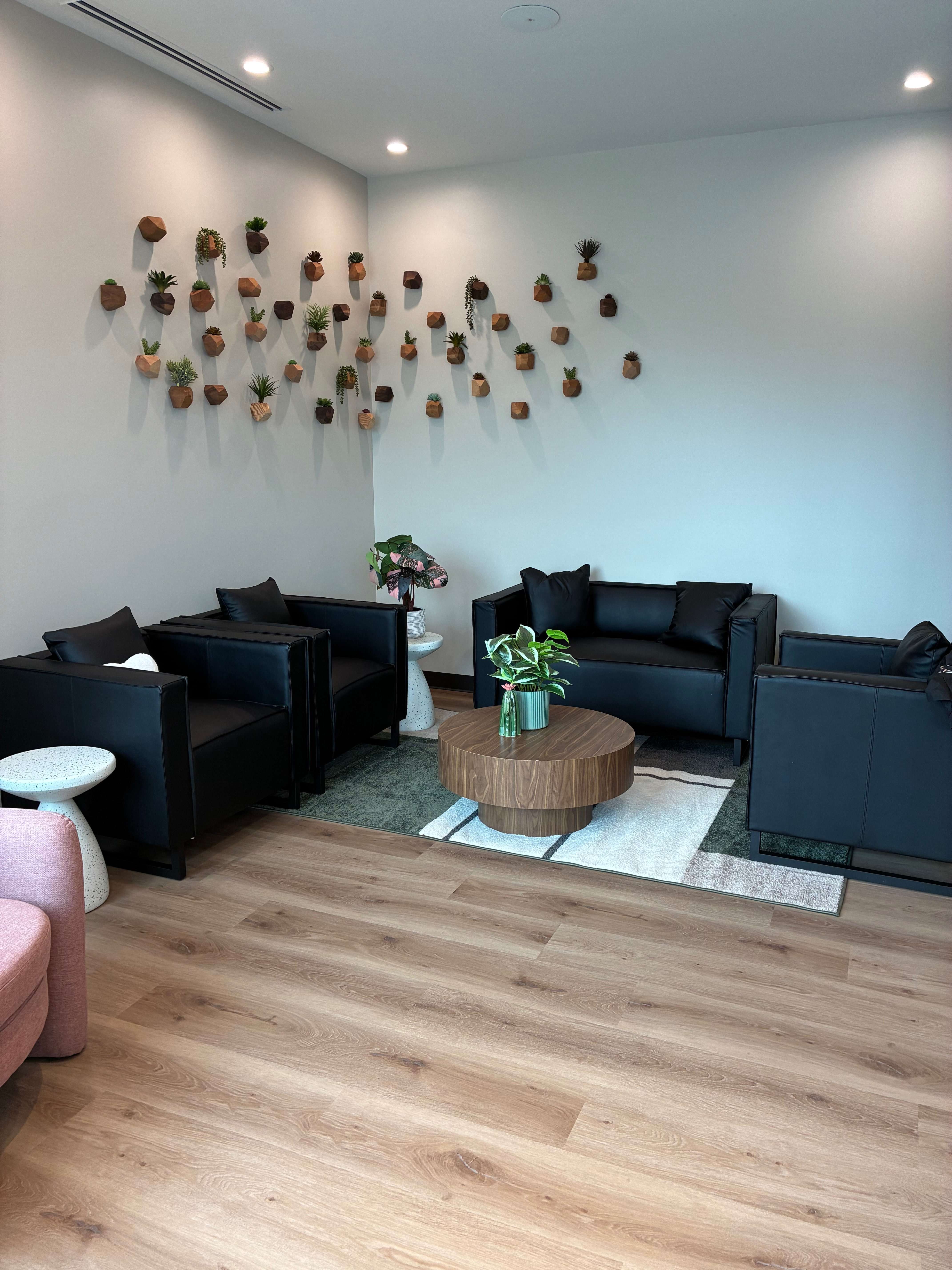 The waiting area inside Leiker Smiles features greenery, modern décor and a welcoming atmosphere designed to help patients feel comfortable from the moment they arrive. Photo by Alin Hett/Hays Post. 