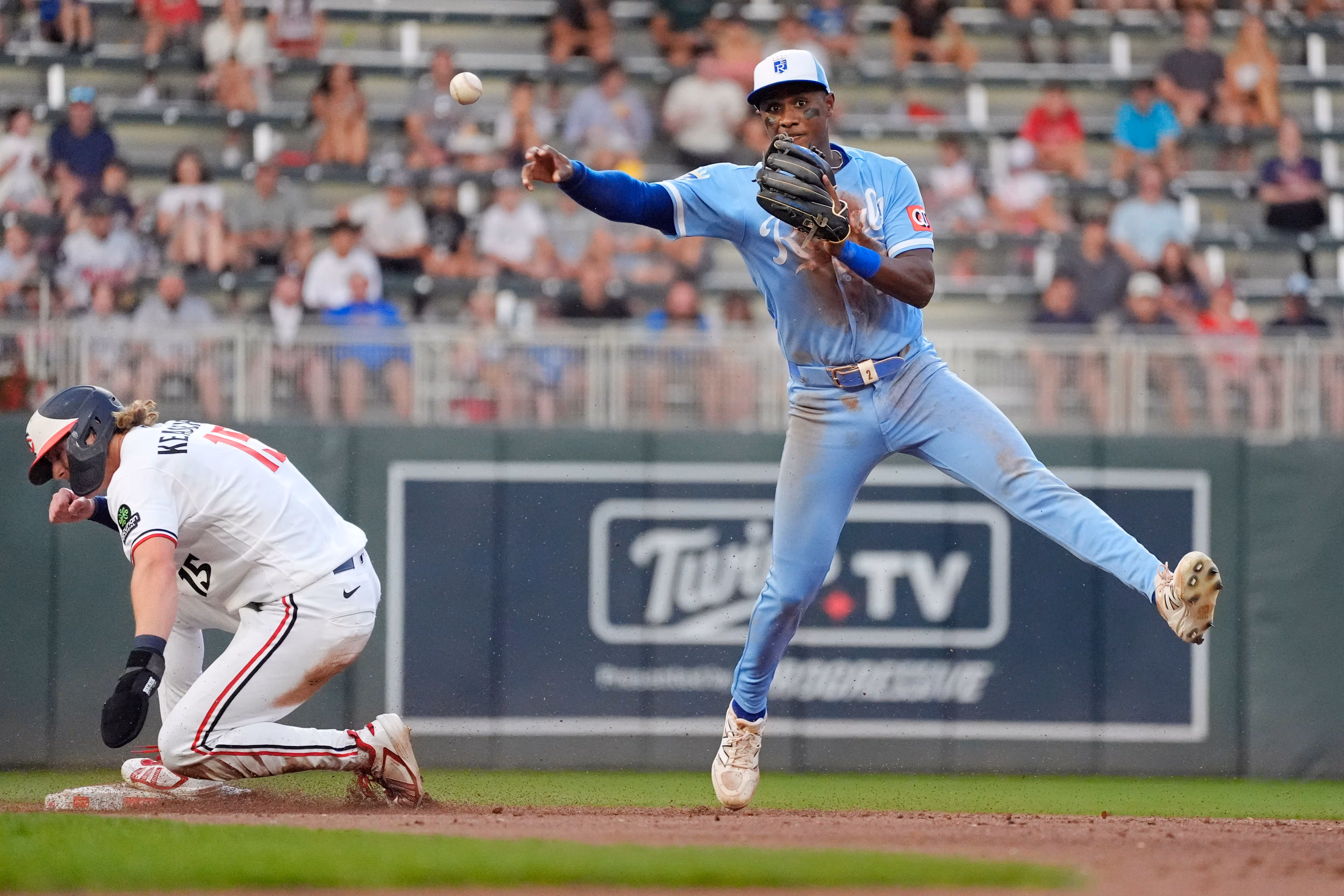 Kansas City Royals right fielder Tyler Tolbert, right, forces out Minnesota Twins' Luke Keaschall (15) but cannot turn the double play on a fielder's choice by Ryan Kreidler in the fifth inning of a baseball game Wednesday, July 29, 2026, in Minneapolis. (AP Photo/Bruce Kluckhohn)