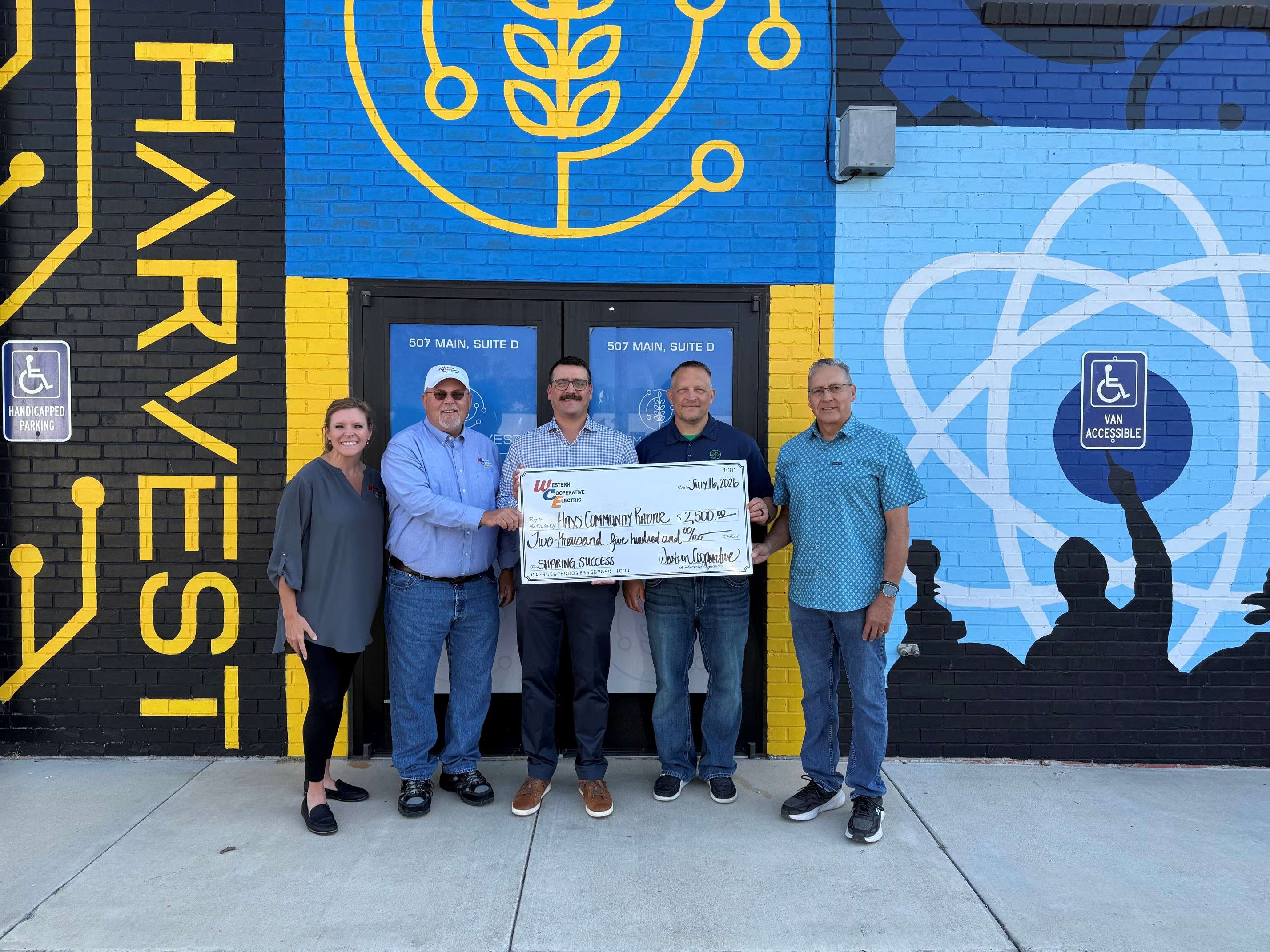Pictured, from left: Christina Hayes (WCE Member Services Manager), Steve Hausler (WCE Board Trustee), Nolan Numrich (WCE CEO/GM), Dallas Hazelhorst (President STEM Harvest), Dr. Kendall Krug (STEM Harvest Board Member & Radar Project Coordinator. )