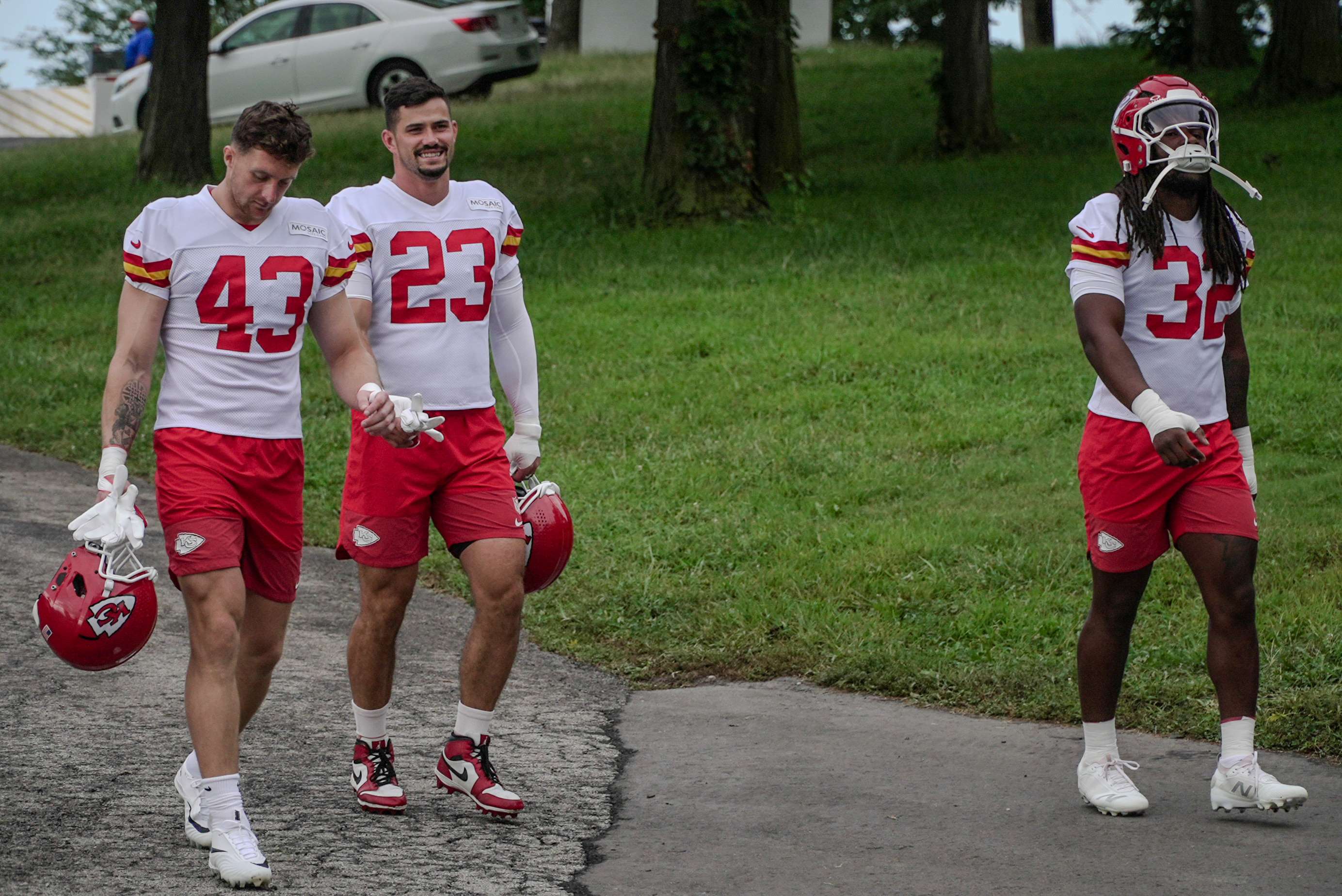 Linebackers Jack Cochrane (43), Drue Tranquill (23), and Nick Bolton (32) make their way down the hill to practice at Missouri Western State University/ Photo by Justin Peacock
