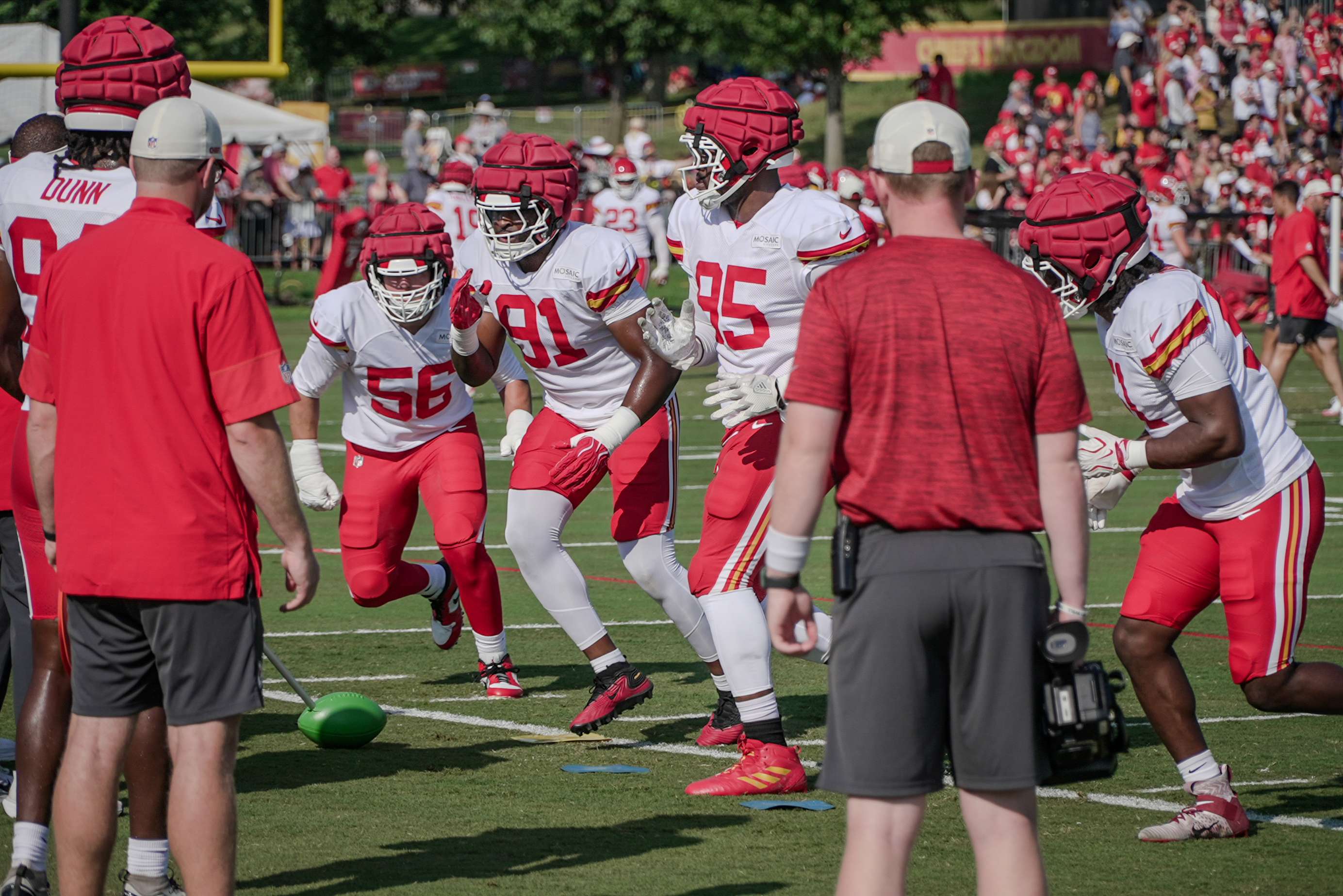 Kansas City Chiefs defensive lineman George Karlaftis (56), Felix Anudike Uzomah (91), and Chris Jones (95) run a drill during the first padded practice at Missouri Western State University/ Photo by Justin Peacock