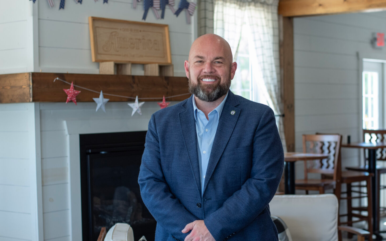  Chris Stigall sits down for an interview at Koch’s General Store in Macon on June 12 (Annelise Hanshaw/Missouri Independent).