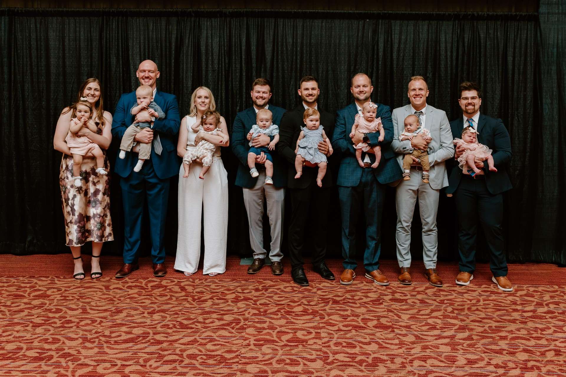 Eight of sixteen residents of the Smoky Hill Family Medicine Residency welcomed babies. (Left to Right) Andrea Vierthaler, MD, Jack Harrigan, MD, Sara Teague, DO, Landon Younger, DO, Nate Clennan, MD, Kyle McGatlin, MD, Josiah McAllister, MD and Orion Battaglia, MD - Christy K Photography, photo
