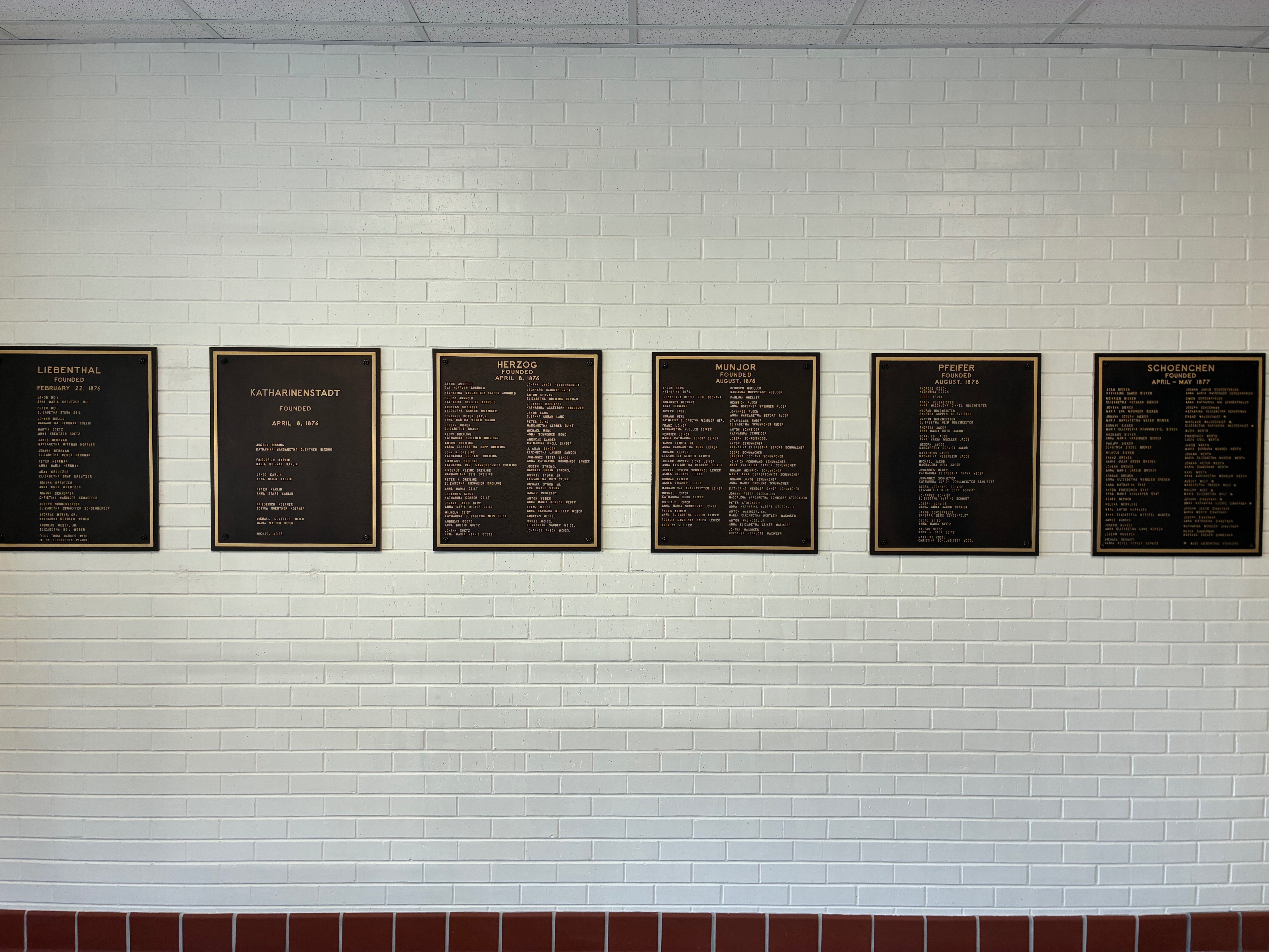 Six Plaques commemorating the first six villages established by Volga German settlers in Ellis County, preserving the history and heritage of the county's early communities.<br>