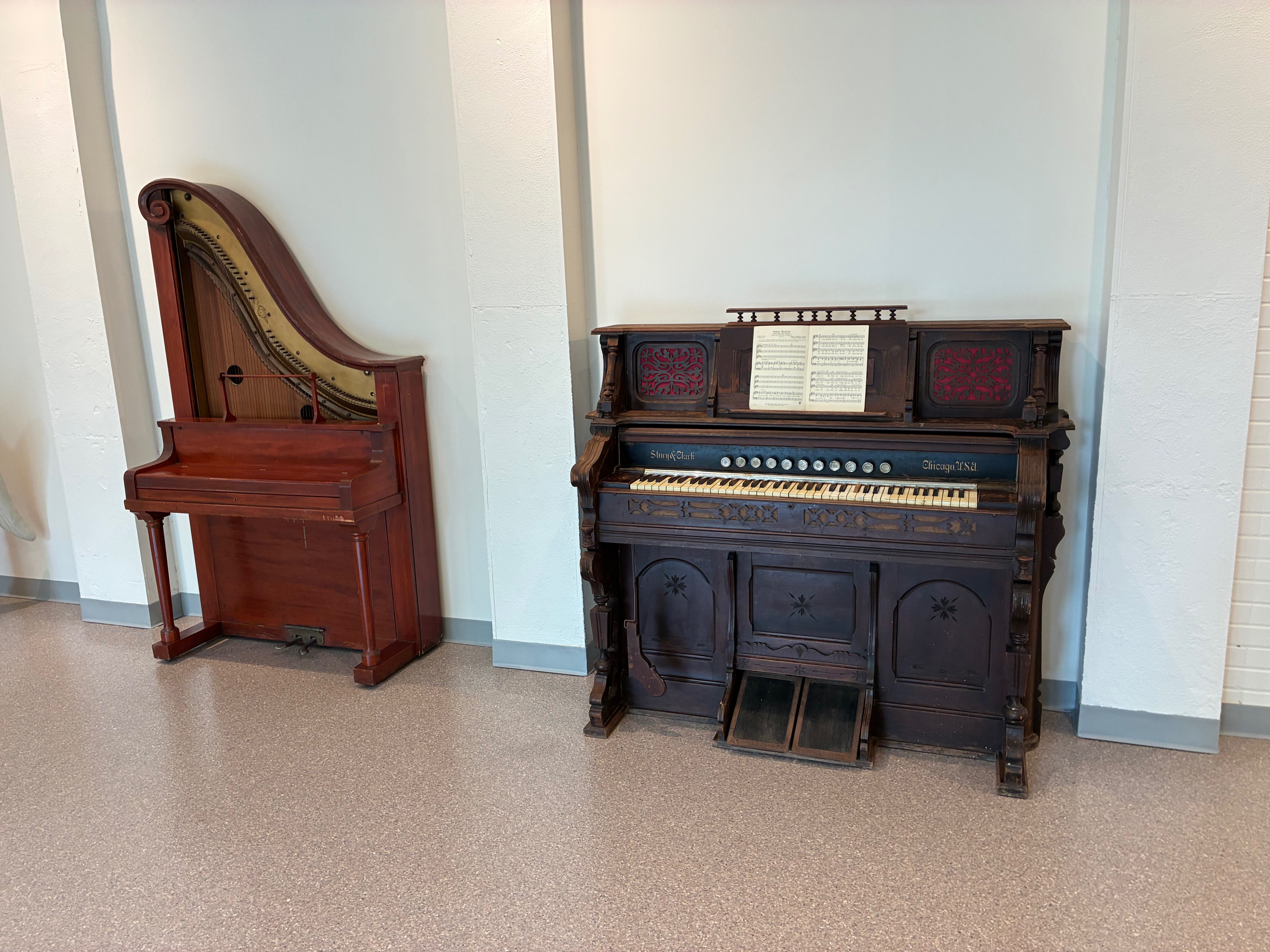 A working Dolcette piano, left, one of six known to remain in the world, and a pump organ, right, are among the historic instruments on display at the Ellis County Heritage Center.<br>