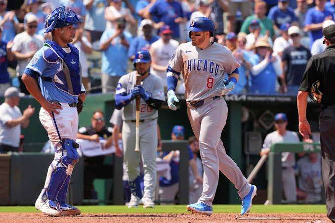 Chicago Cubs' Ian Happ crosses the plate after hitting a two-run home run during the sixth inning of a baseball game against the Kansas City Royals, Sunday, Aug. 9, 2026, in Kansas City, Mo. (AP Photo/Charlie Riedel)
