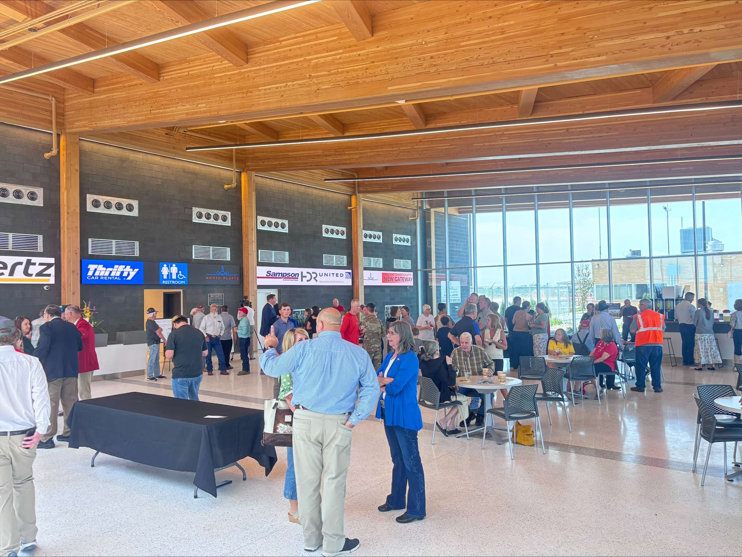 Community members and visitors gather inside the new North Platte Regional Airport terminal during Monday’s grand opening. The facility includes passenger seating, food and beverage space and access to commercial air service operated by SkyWest Airlines under the United Airlines brand. (Allison Peck | The Post)