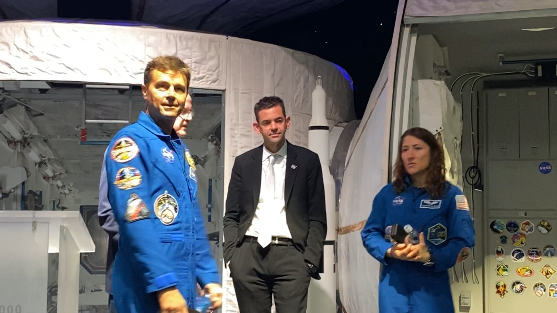 Artemis II Commander Reid Wiseman (L), NASA Administrator Jared Isaachman (M), and Mission Specialist Christina Koch (R). Following their presentation at the Cosmosphere on Aug. 11, 2026