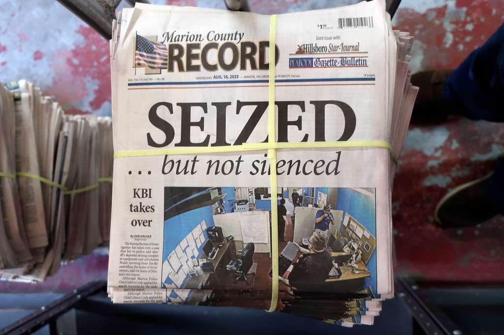 FILE - A stack of the Marion County Record sits in the back of the newspaper's building, awaiting unbundling, sorting and distribution, Aug. 16, 2023, in Marion, Kan. (AP Photo/John Hanna, File)