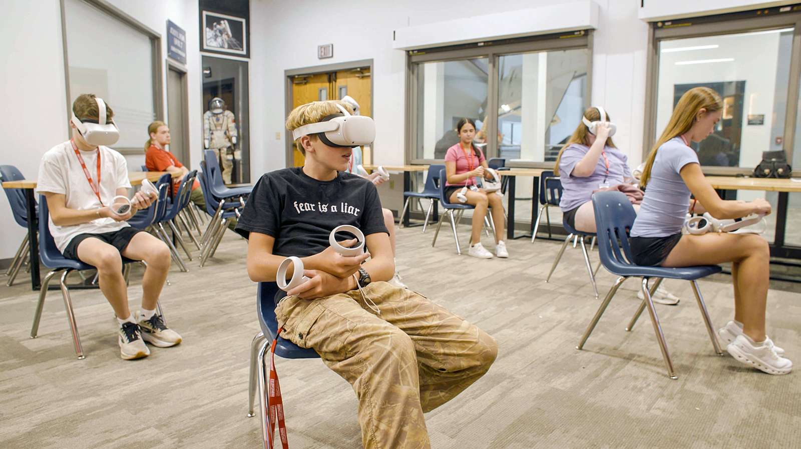 Campers at the Cosmosphere use virtual reality headsets to interact with "ISS- Rupture," an interactive game that simulates fixing micro air leaks on the International Space Station and was developed by K-State Salina students - Photos K-State Salina