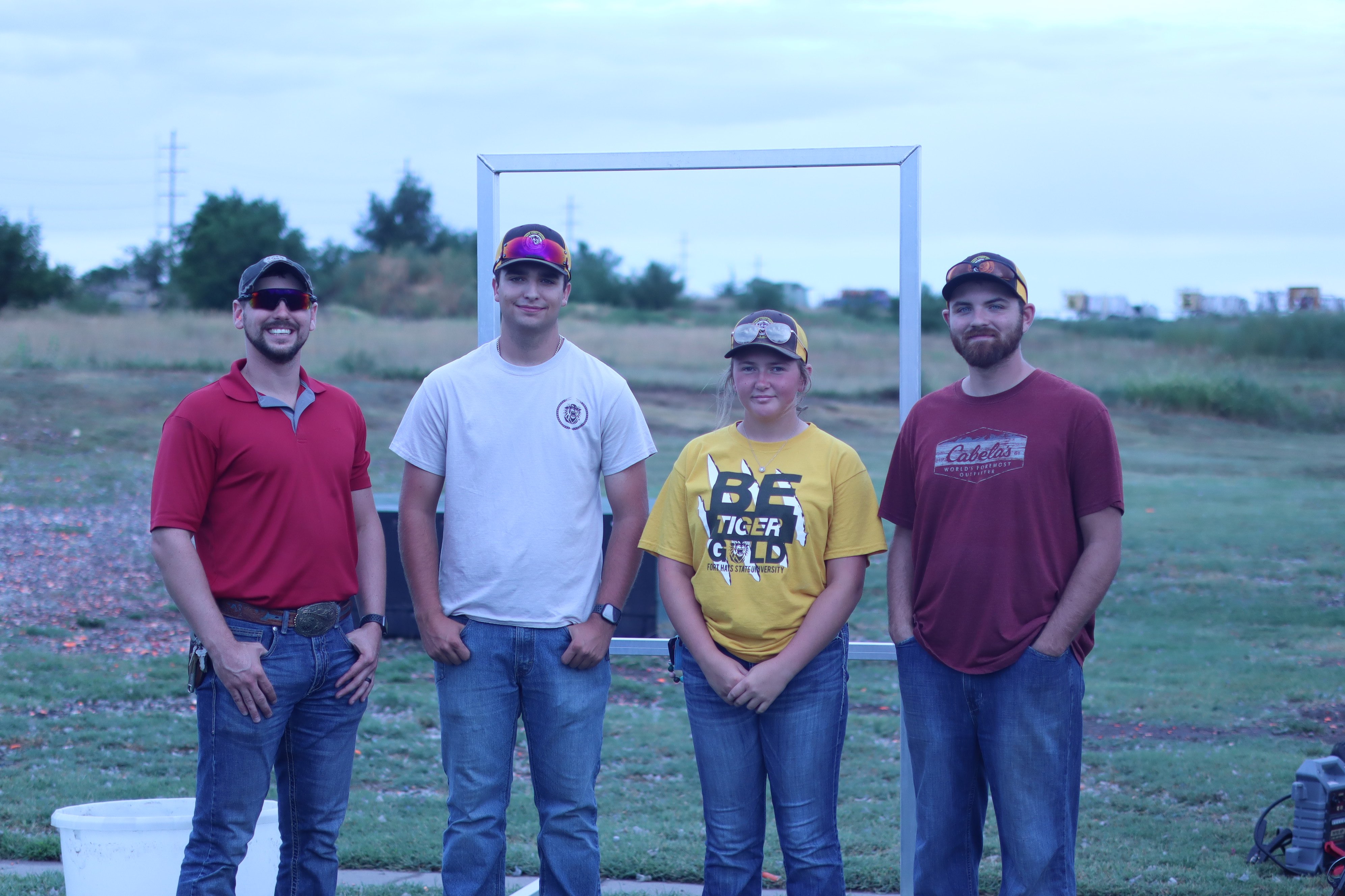 From left: Jerod Lies, head coach of the Fort Hays State University shotgun team, &nbsp;Cole McDonough, Ryllie Lippelmann and Gabe Seller, an FHSU student, pose during the 29th annual Youth Outdoor Festival.<br>