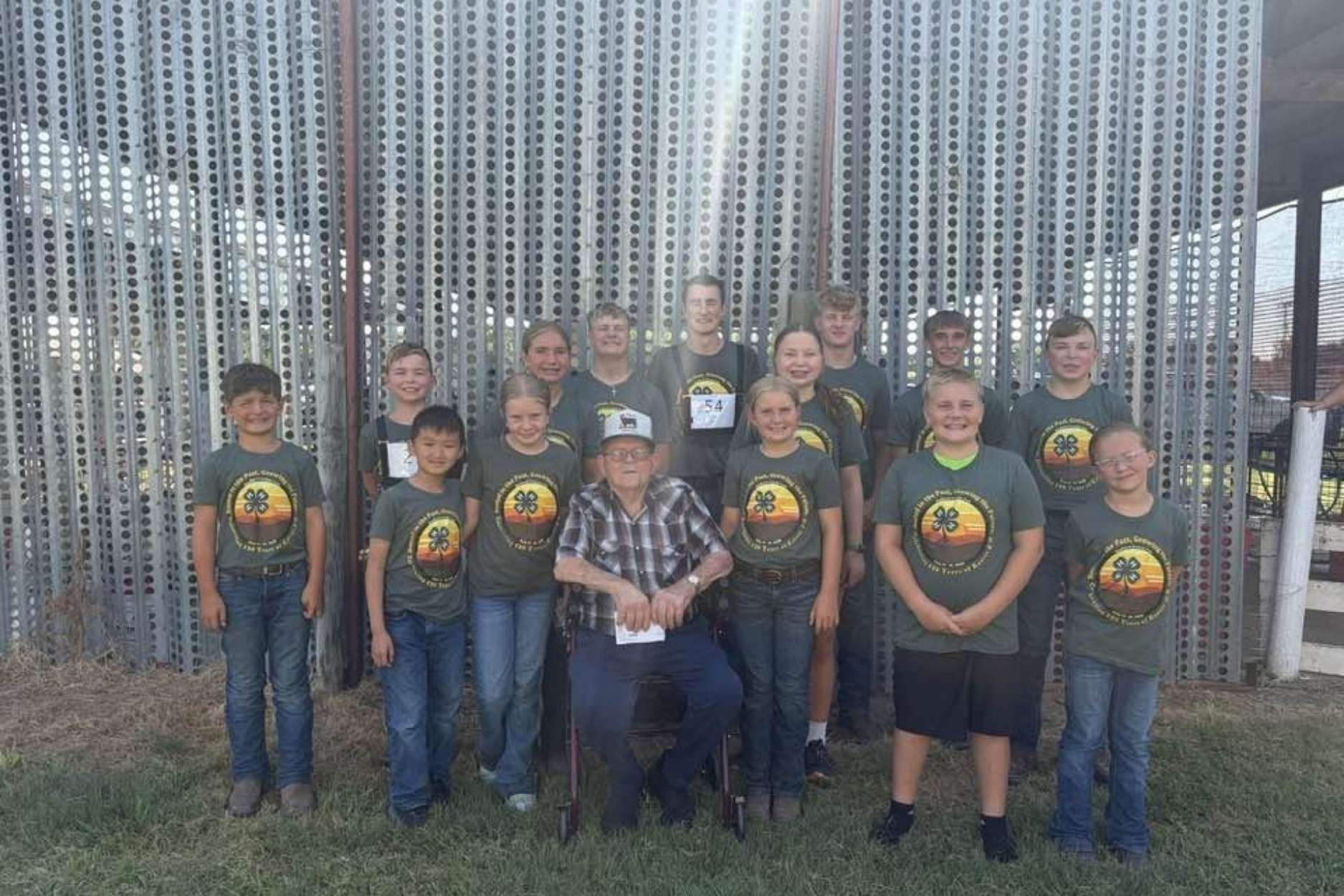 Marion Alpers surrounded by 14 of his great-grandchildren — all of whom have participated in the Jolly Workers 4-H club. (photo courtesy of K-State Extension)