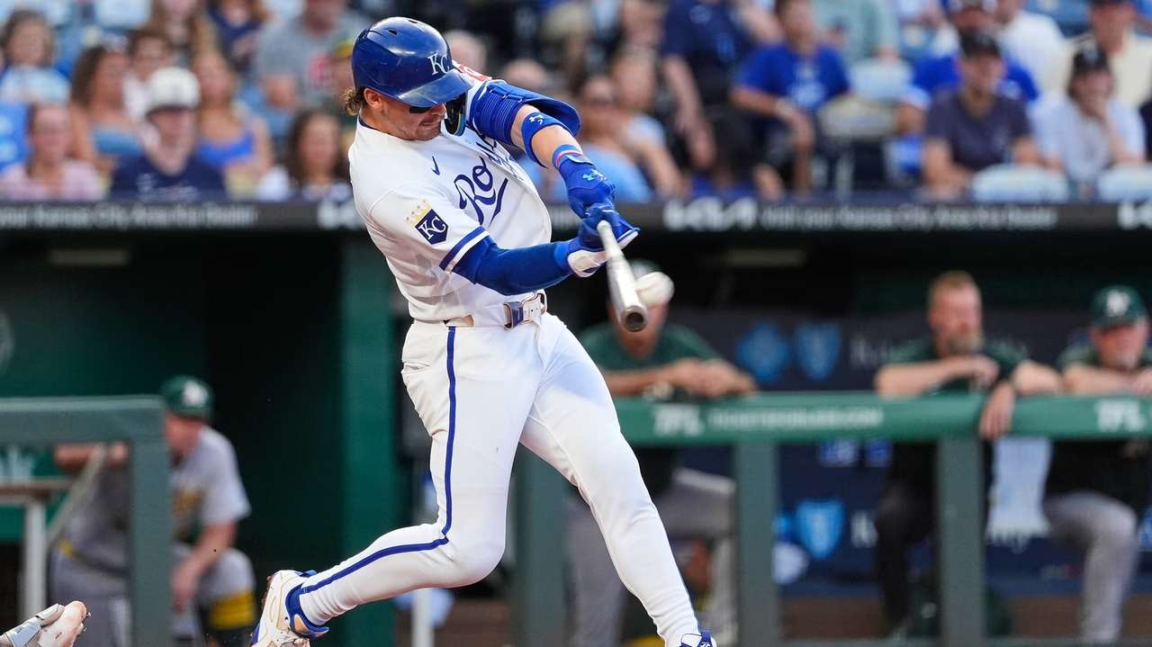 Kansas City Royals' Bobby Witt Jr. hits a two-run home run during the second inning of a baseball game against the Athletics, Monday, Aug. 17, 2026, in Kansas City, Mo. (AP Photo/Charlie Riedel)