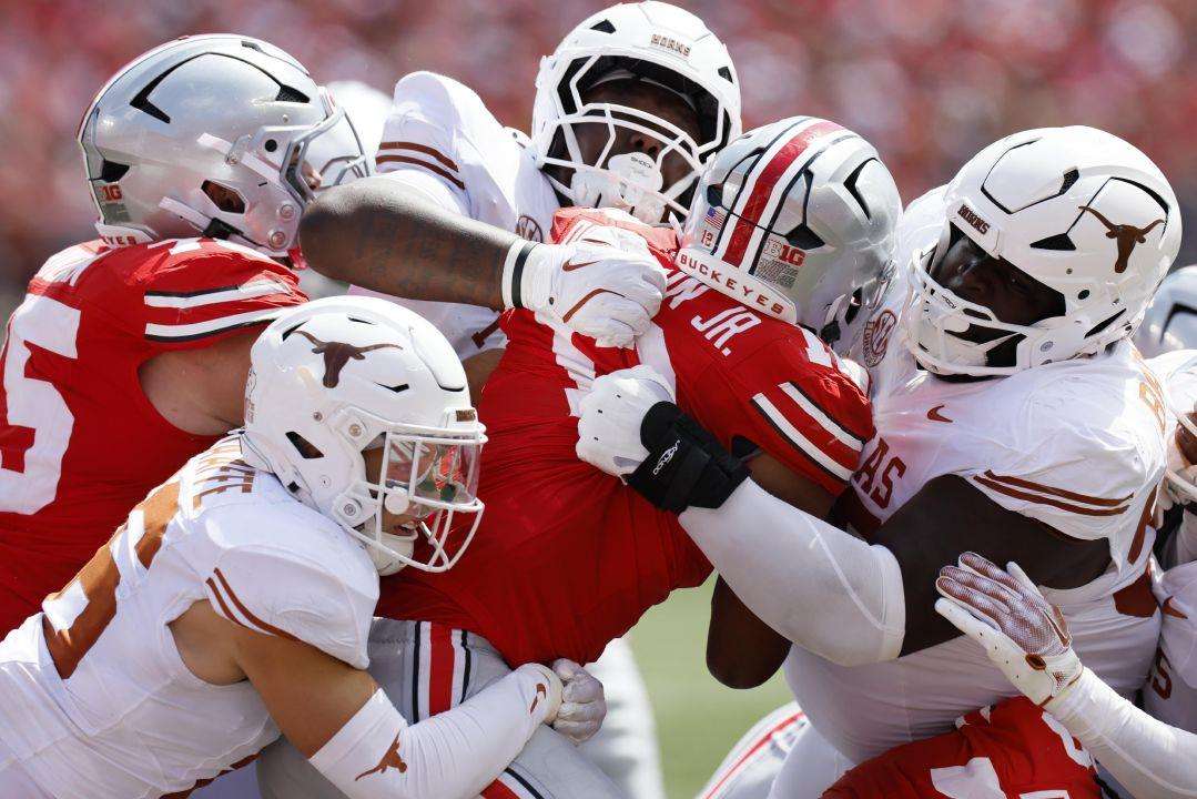 Ohio State running back CJ Donaldson is stopped by the Texas defense during the second half of an NCAA college football game in Columbus, Ohio., Aug. 30, 2025. (AP Photo/Jay LaPrete, File)