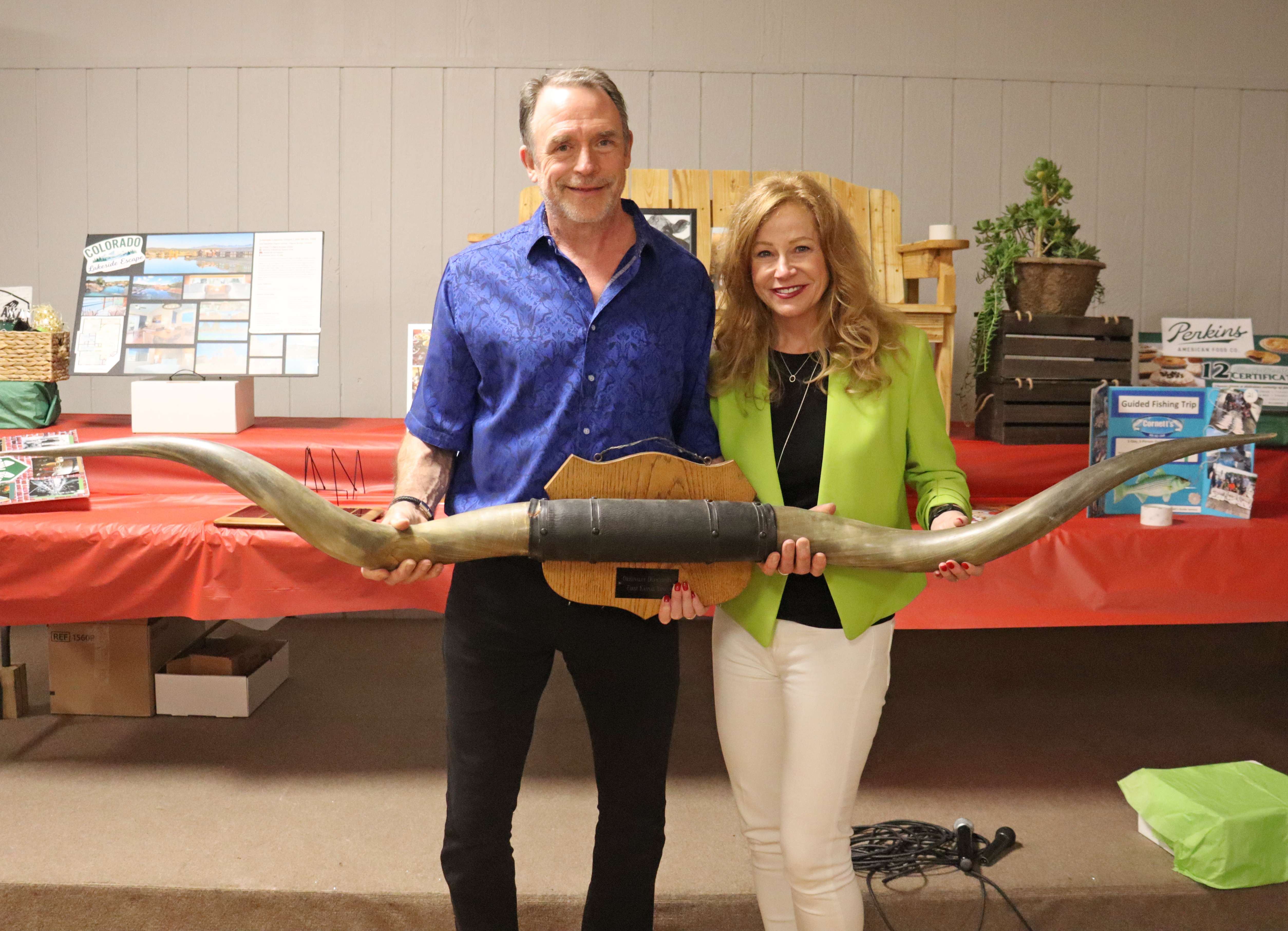 Dr. Mark Fesen of Central Care Cancer Center and his wife, Brenda, celebrate after securing the Longhorn Honor during the Clara Barton Foundation’s Annual Benefit Auction. Dr. Fesen is beginning his 34th year of serving patients in Barton County.