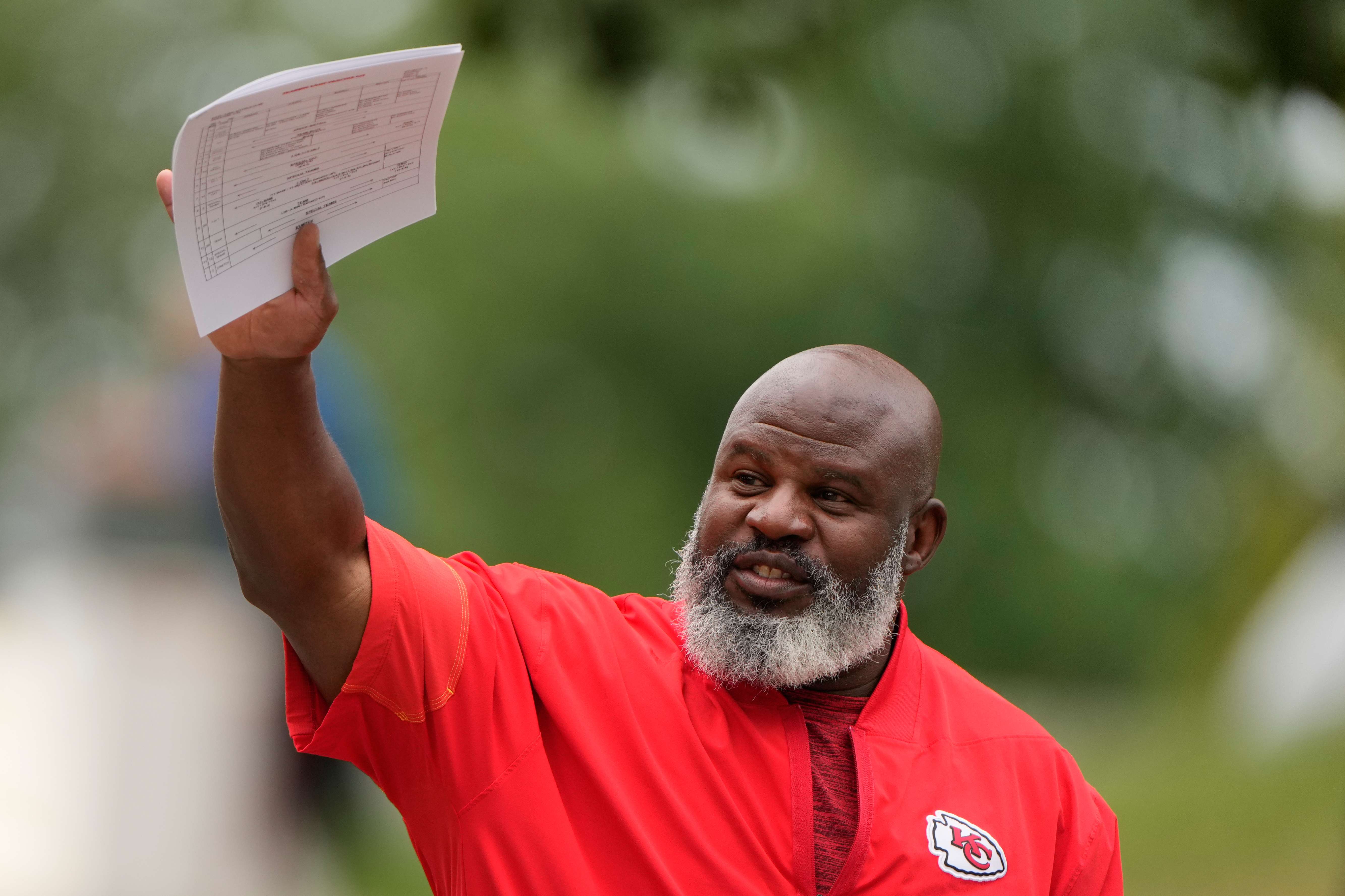 Kansas City Chiefs offensive coordinator Eric Bieniemy arrives at NFL football training camp Tuesday, Aug. 11, 2026, in St. Joseph, Mo. (AP Photo/Charlie Riedel)