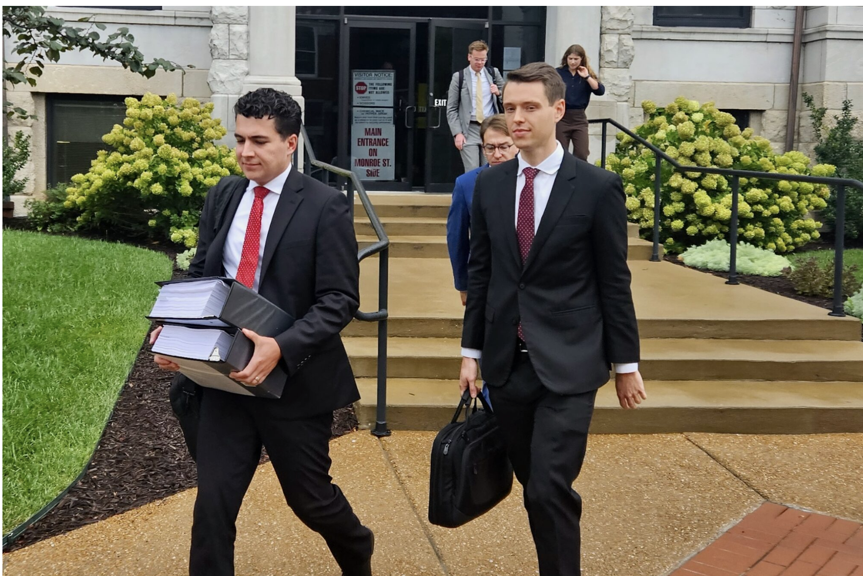 Lou Capozzi, right, solicitor general of Missouri, and Michael Patton of the attorney general’s office leave the Cole County Courthouse on Wednesday after the trial over whether Missourians will have a referendum on redistricting on the November ballot (Rudi Keller/Missouri Independent).