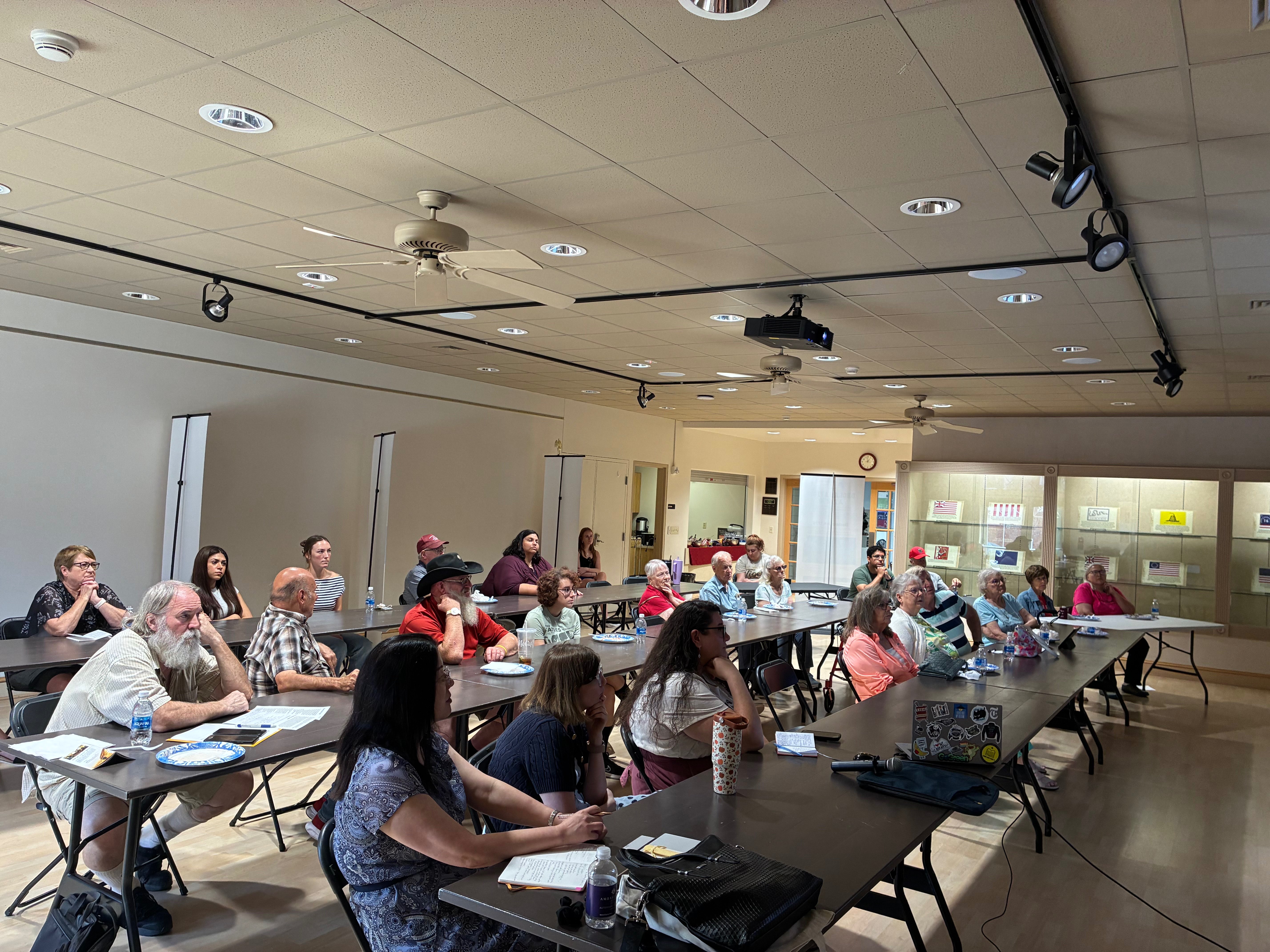 An overhead view shows attendees listening to Jeffrey D. Jackson’s presentation on the First Amendment and freedom of speech during the Hays Public Library’s Lunch and Learn event.&nbsp;Photo by Alin Hett/Hays Post<br>