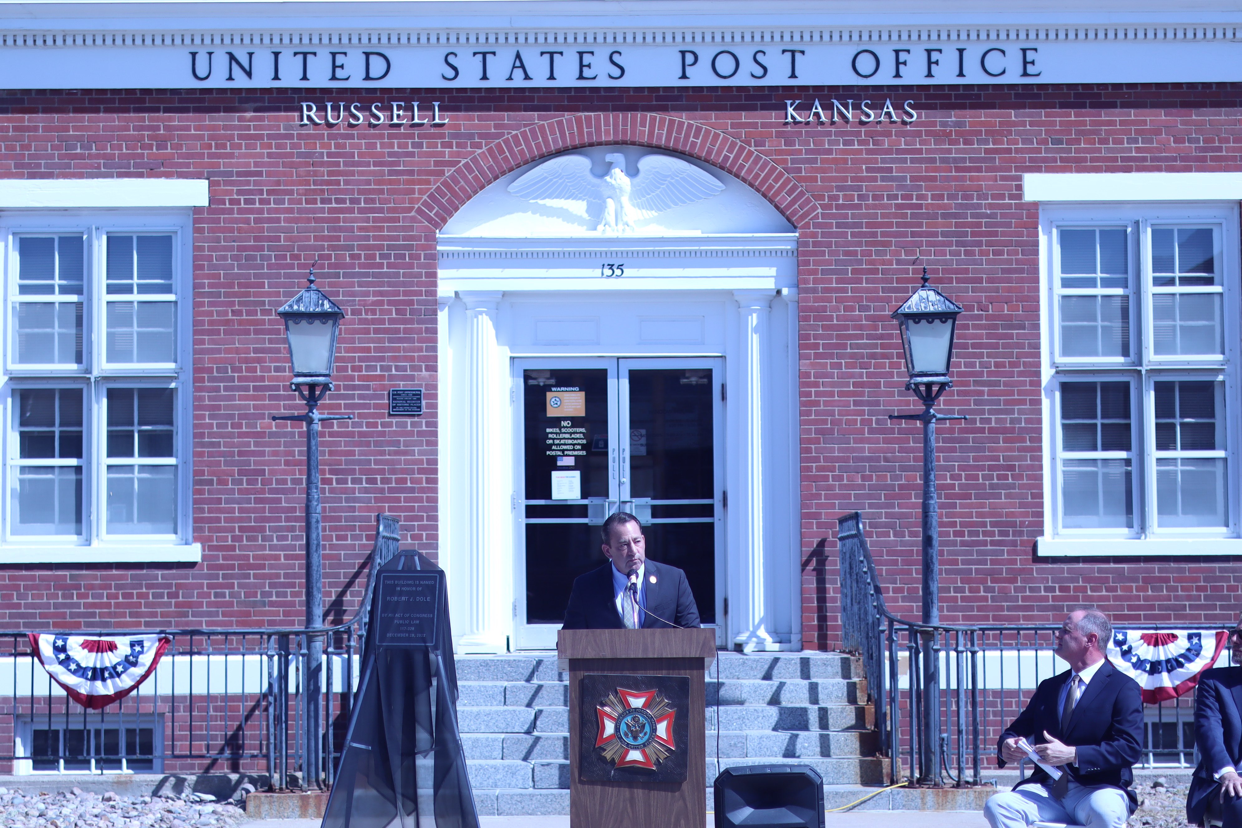 Kansas state Rep. Troy Waymaster, a Russell High School graduate, speaks during the ceremony honoring Bob Dole.<br>