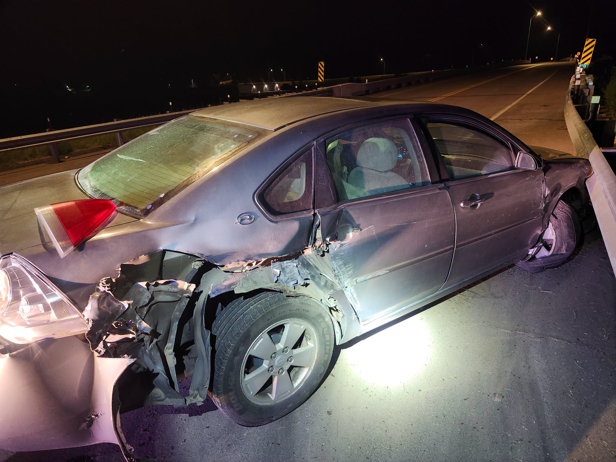 The Lincoln County Sheriff’s Office released this photo showing the damage to a vehicle after it struck a guardrail on the Highway 30 overpass on Link 56D near Brady early Saturday morning. (Lincoln County Sheriff's Office)