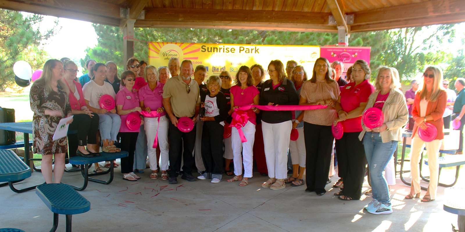 Women Who Lead members with Jeff Boyle, Hays parks director, cut the ribbon on improvements at Sunrise Park on Thursday. Photo by Cristina Janney/Hays Post