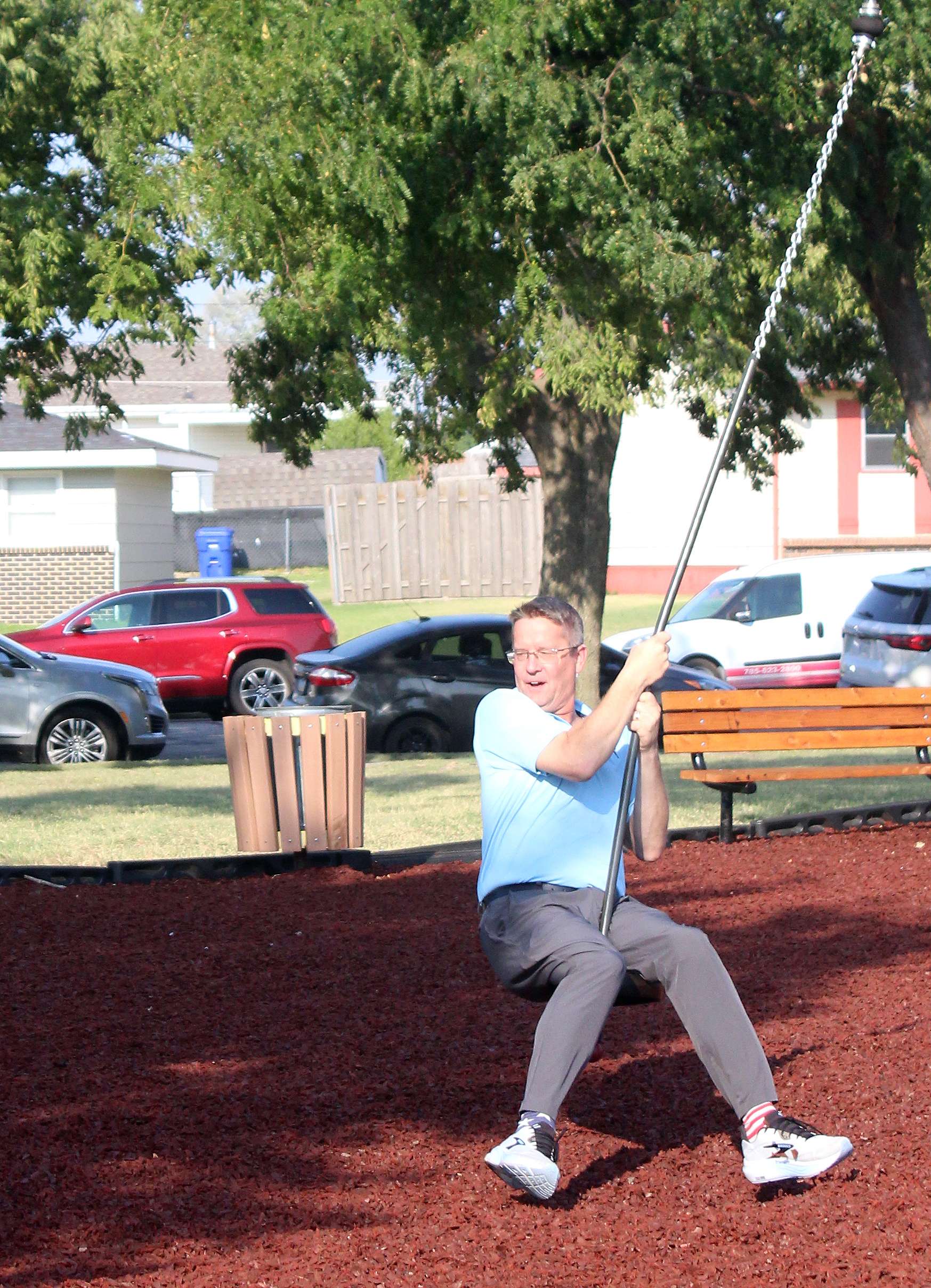 Shaun Musil, Hays city commissioner, tries out the new zipline at Sunrise Park. Photo by Cristina Janney/Hays Post