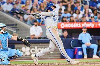 Kansas City Royals' Jac Caglianone (14) hits a two-run single against the Toronto Blue Jays during the sixth inning of a baseball game in Toronto, Thursday, Aug. 27, 2026. (Sammy Kogan/The Canadian Press via AP)
