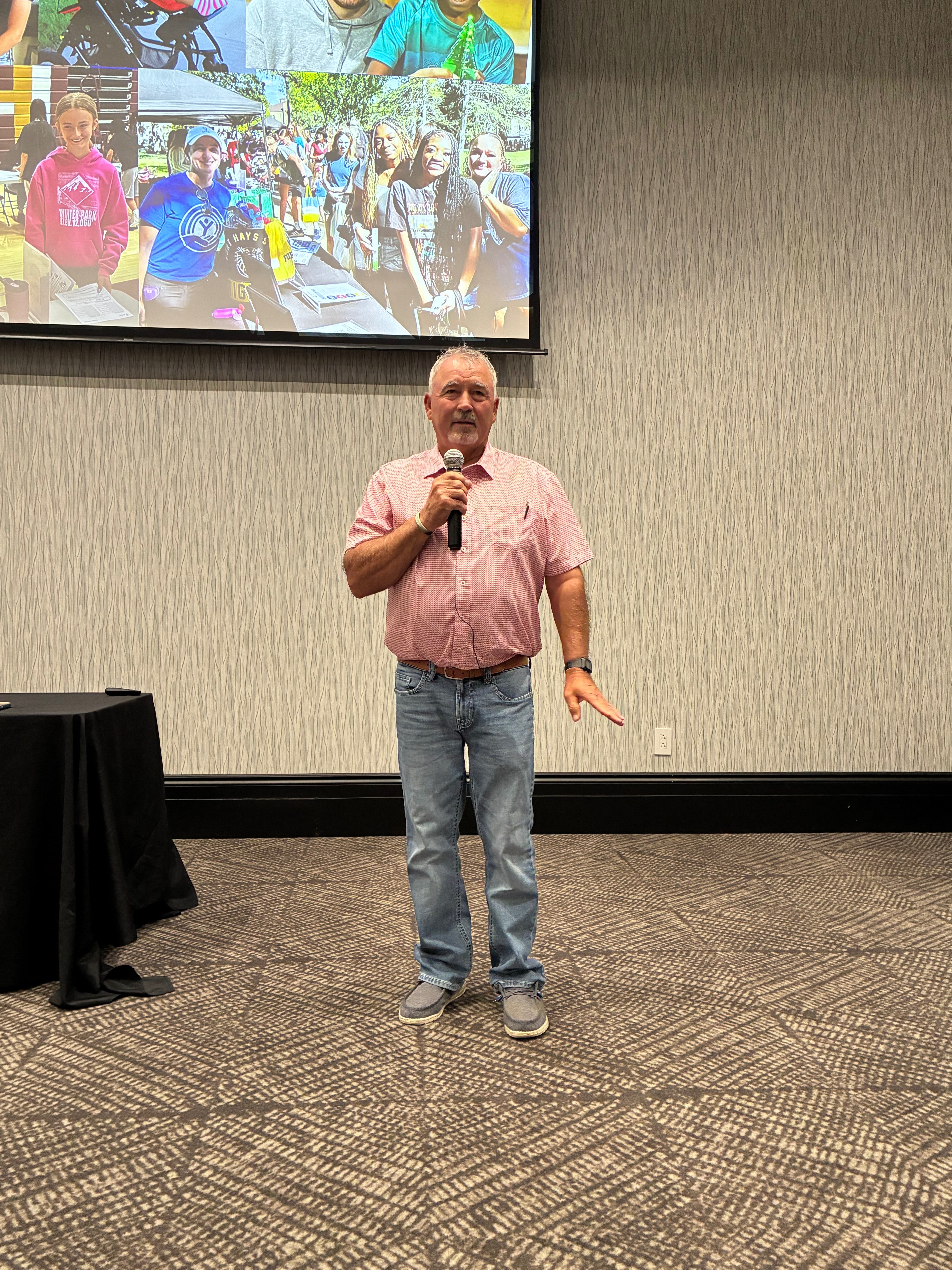 Neal Younger, Ellis County commissioner, shares his family’s experience with United Way-supported organizations during the United Way Kickoff Lunch on Friday in Hays. Photo by Alin Hett/Hays Post<br>