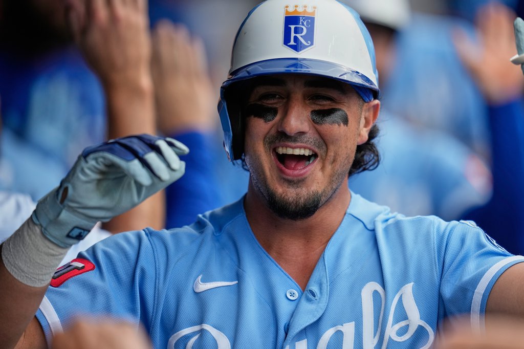 Kansas City Royals' Josh Rojas is congratulated in the dugout after hitting a home run in the eighth inning of a baseball game against the Cleveland Guardians in Cleveland, Saturday, Aug. 29, 2026. (AP Photo/Sue Ogrocki)