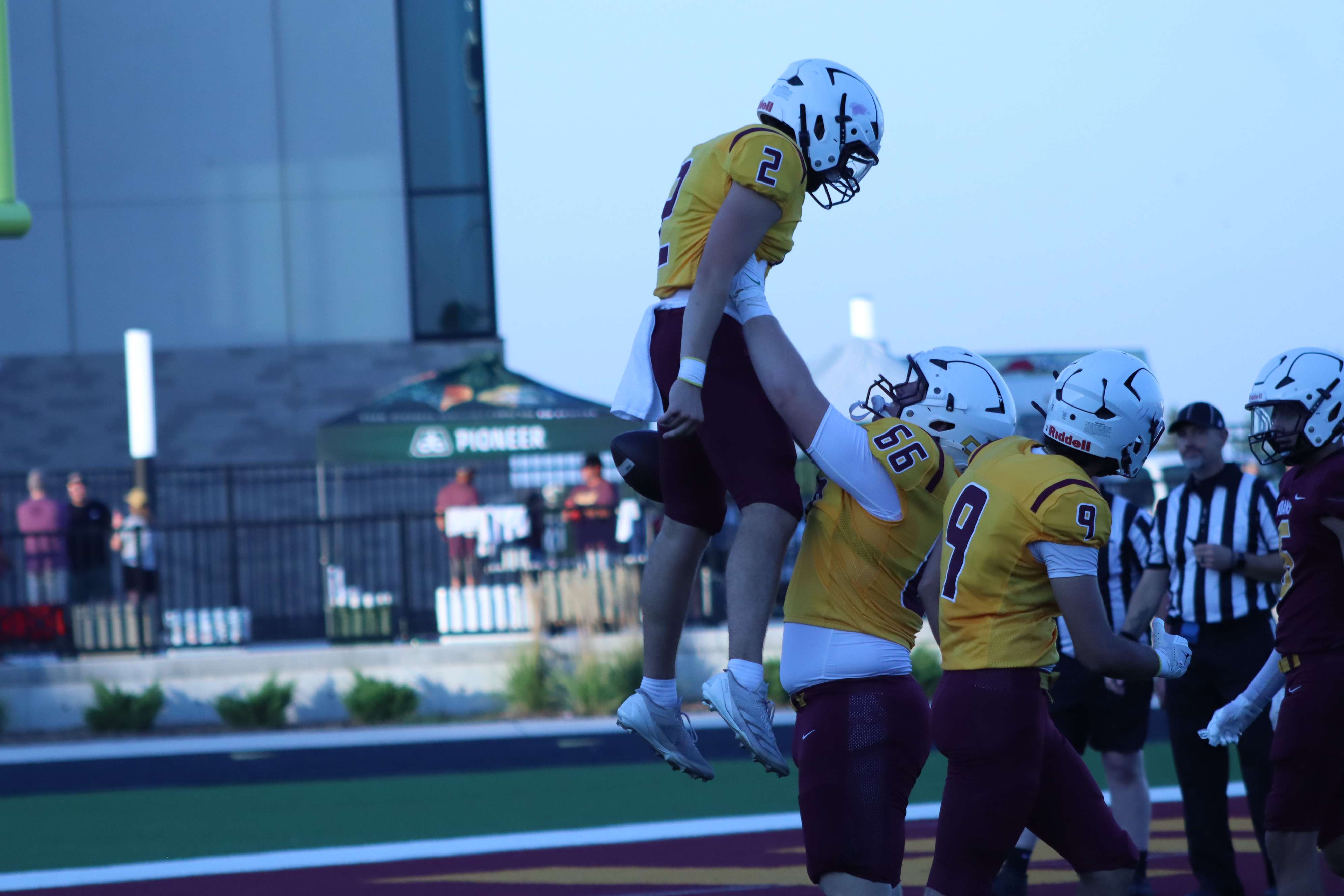 (66) Oregon commit Gus Corsair hoists (2) Joey Dintino in the air following a touchdown run.