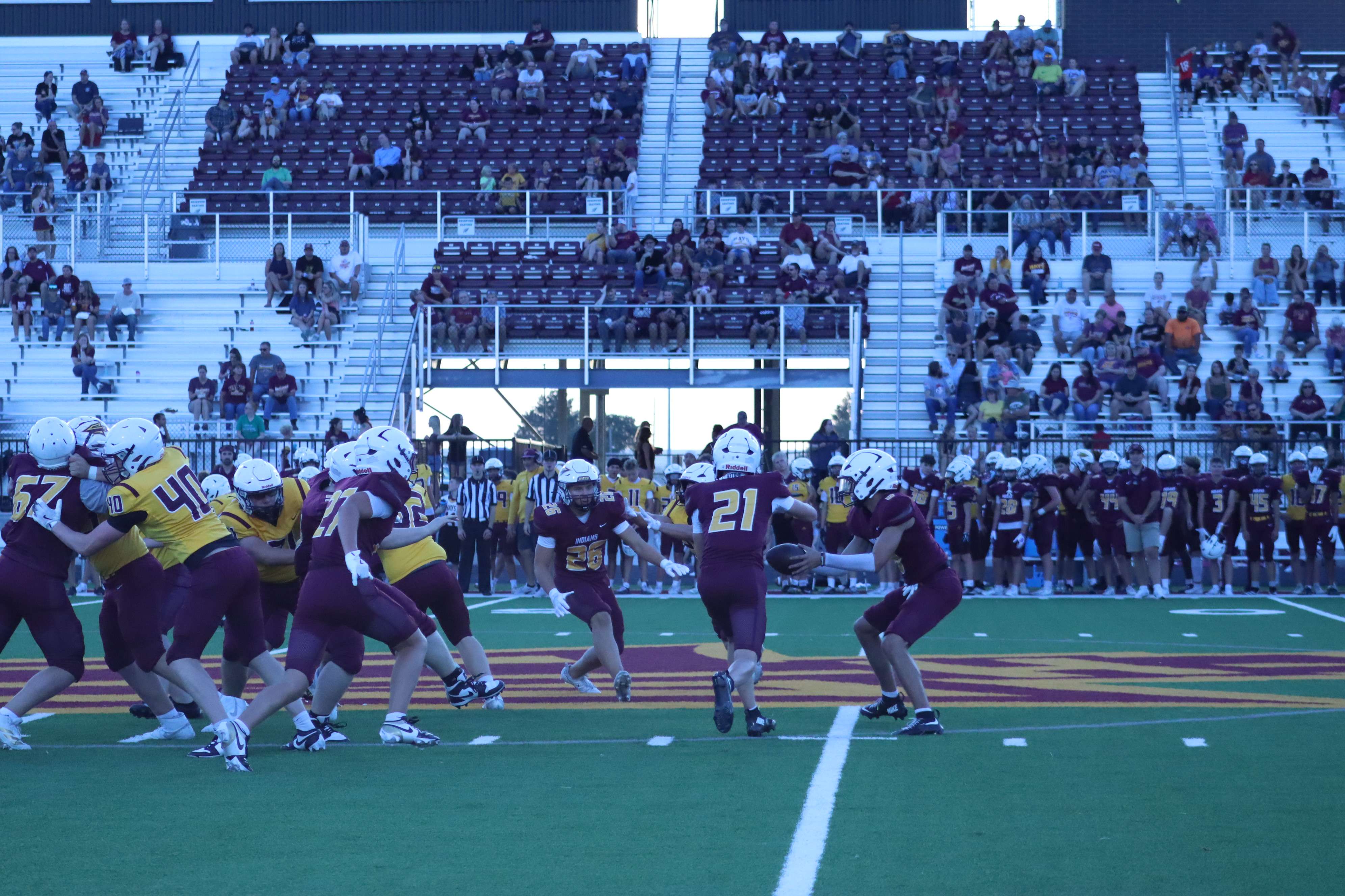 (21) Laken Pasek takes a handoff.