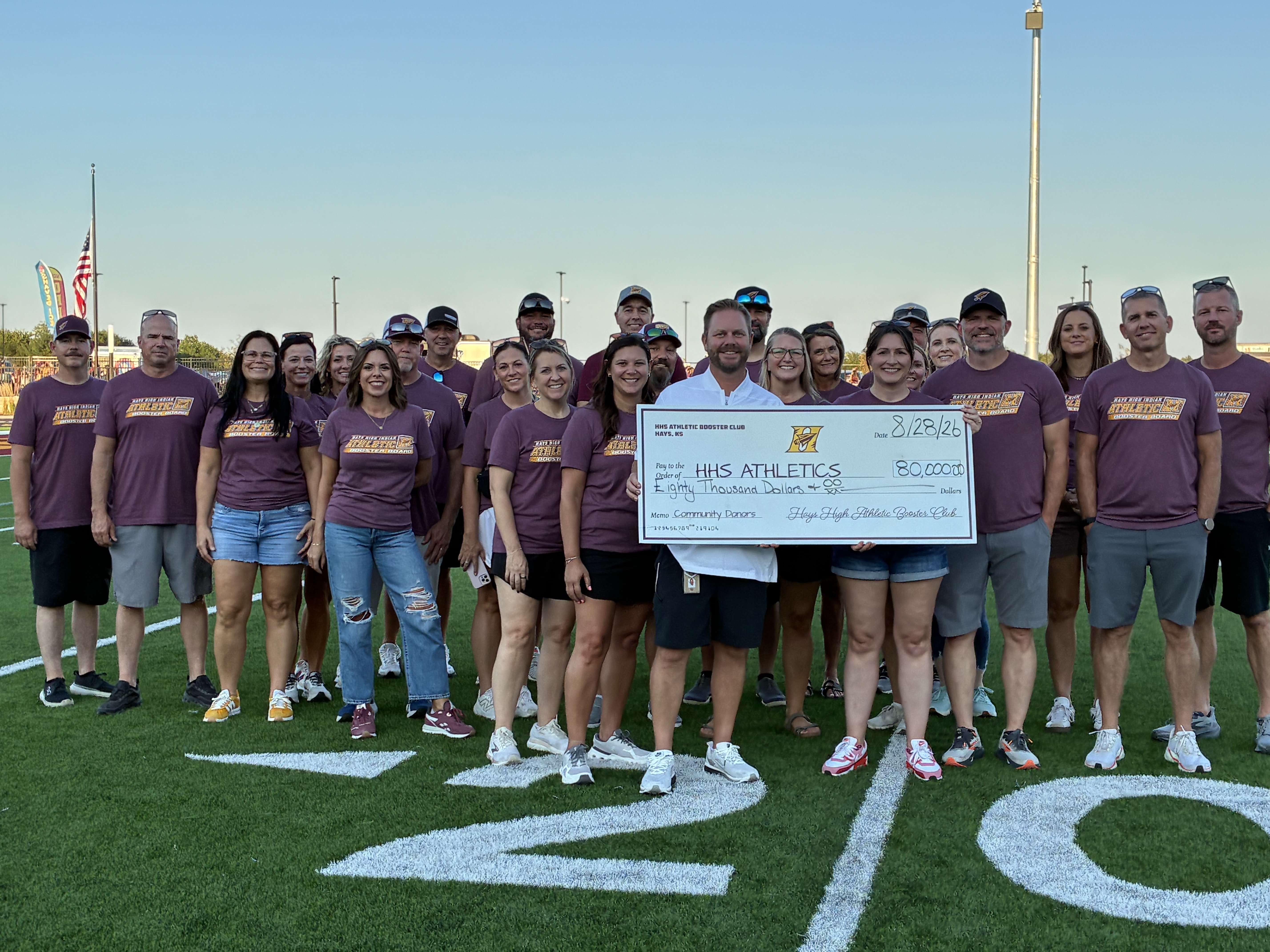 Hays High Athletic Booster Club presents a check to the Athletic Department for $80,000.