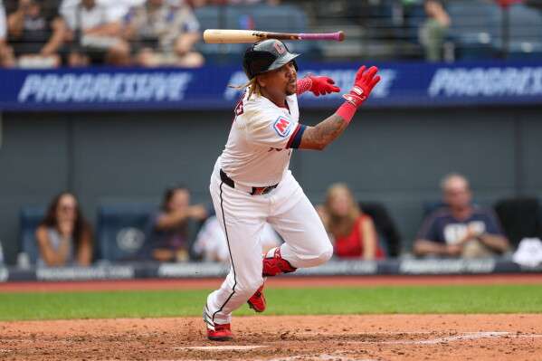 Cleveland Guardians' José Ramírez starts to run after hitting a single against the Kansas City Royals in the sixth inning of a baseball game in Cleveland, Sunday, Aug. 30, 2026. (AP Photo/Tim Phillis)