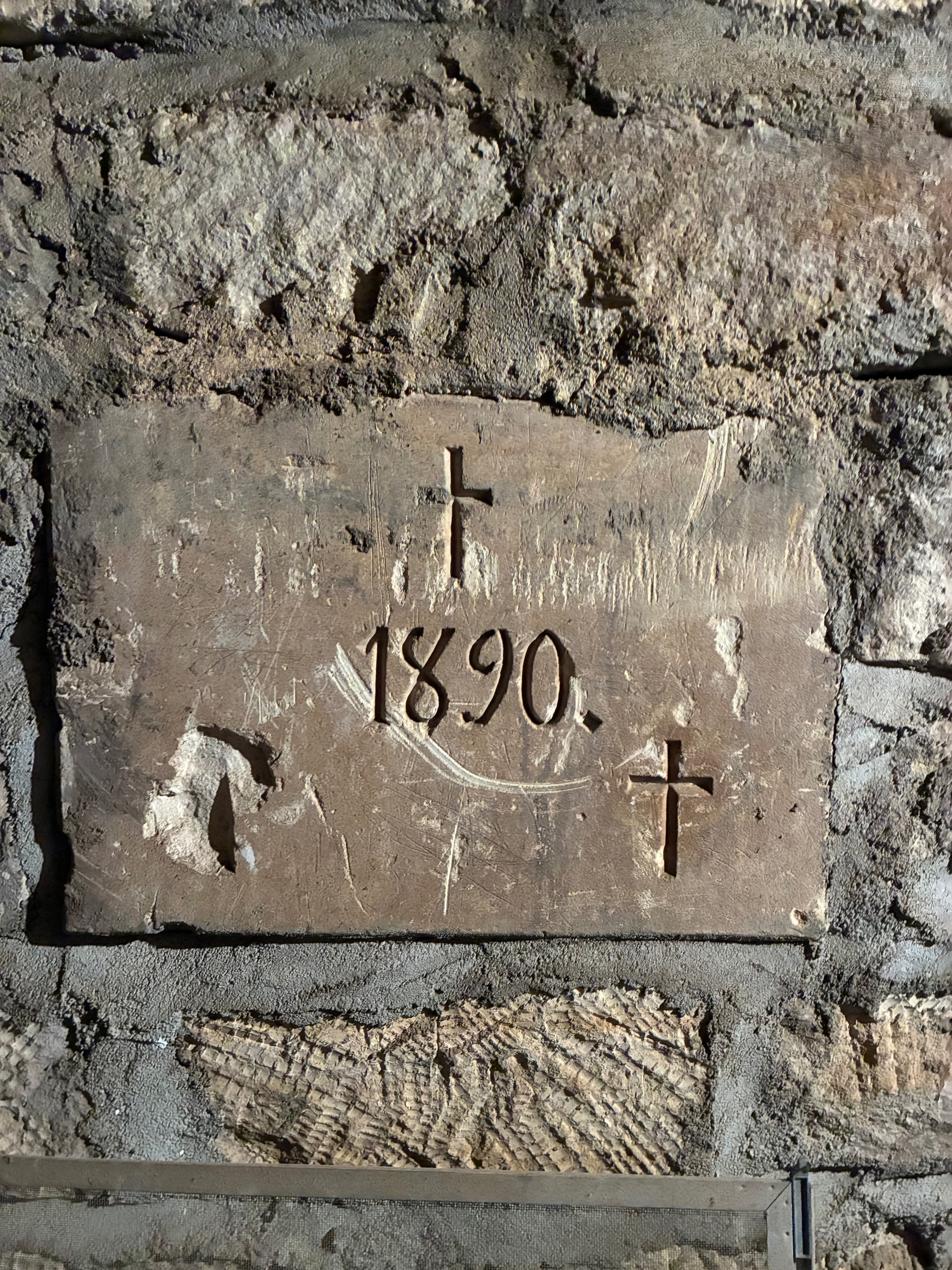 The original cornerstone of the church, inscribed with the year 1890. Photo by Alin Hett/Hays Post<br>