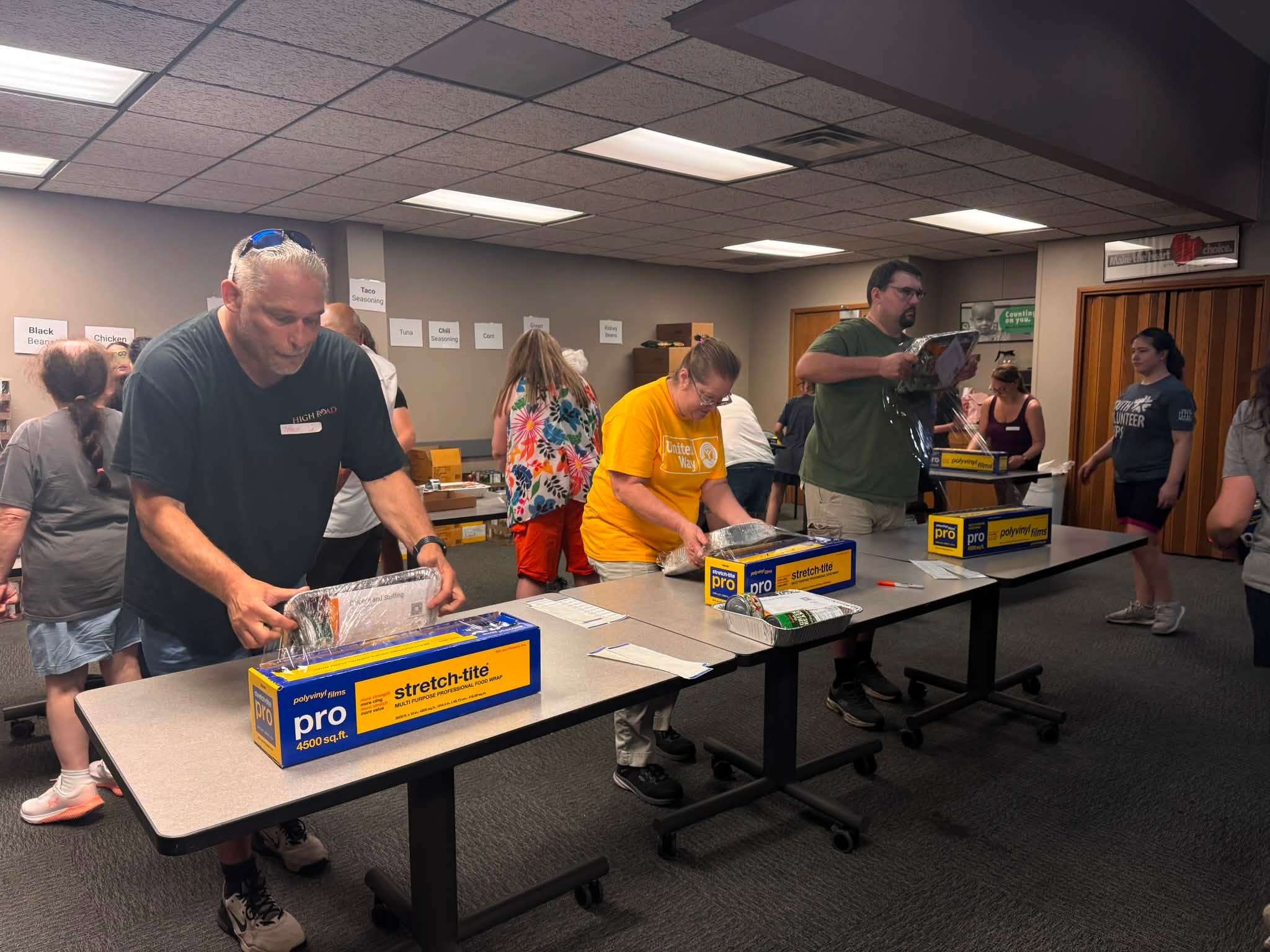 Volunteers with the Caring Connections Crew pack meal kits at the United Way of Greater St. Joseph offices/ Photo courtesy of the United Way of Greater St. Joseph