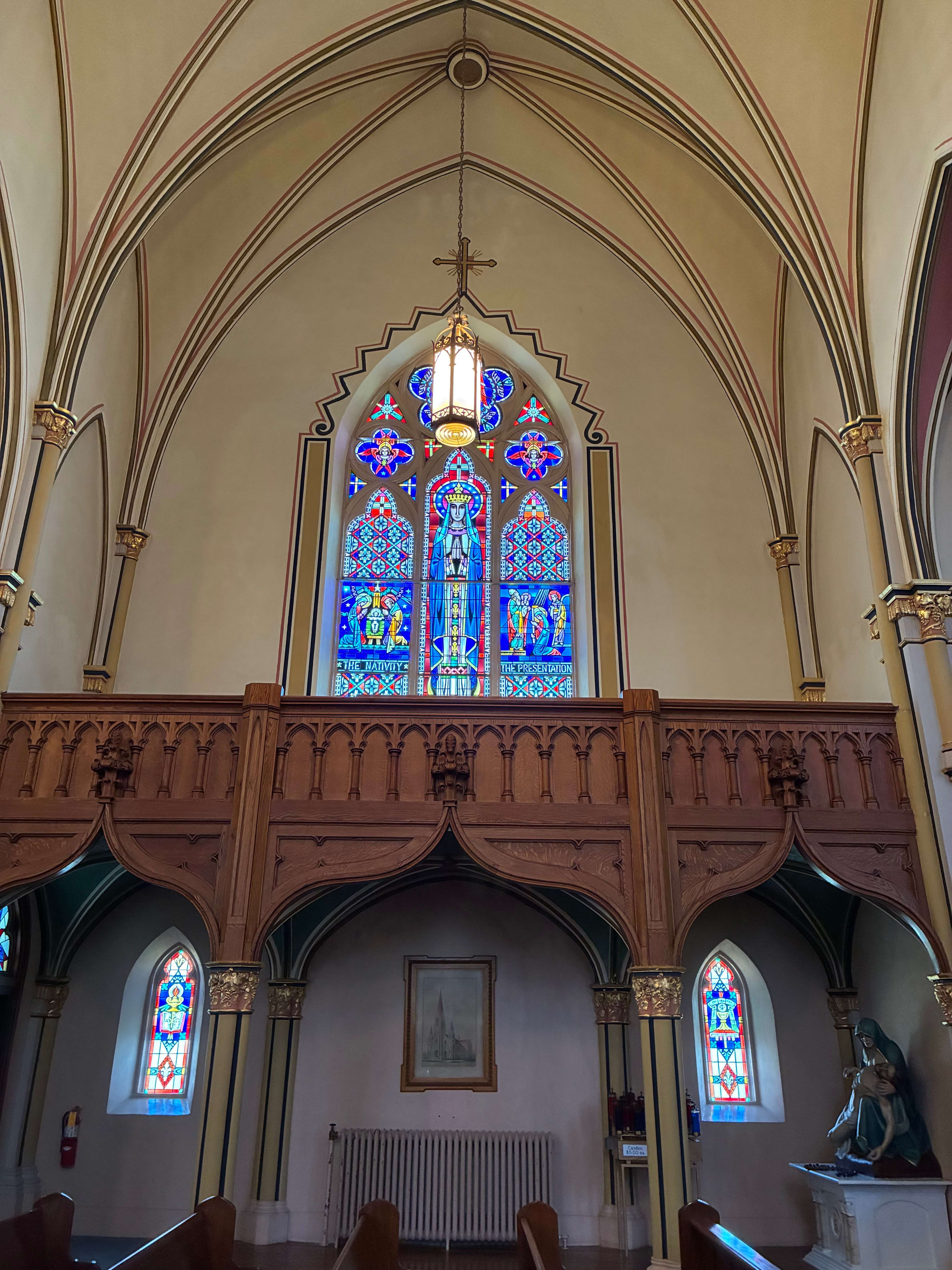 The large stained-glass window above the church balcony, where rotted wood was previously discovered around a central structural piece. Photo by Alin Hett/Hays Post
