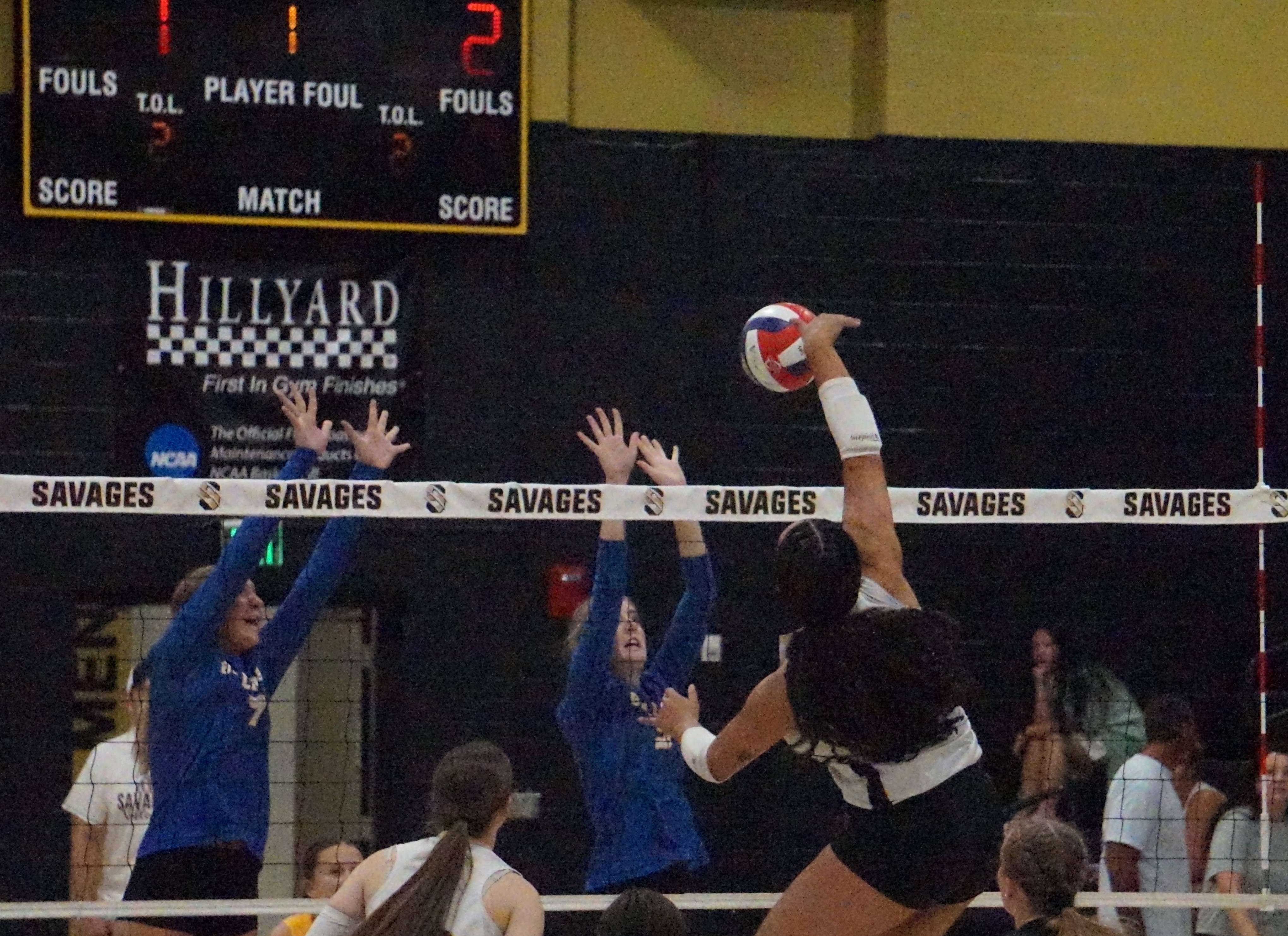 Savannah's Aryana Spry (22) goes for the spike against East Buchanan/ Photo by Matt Pike