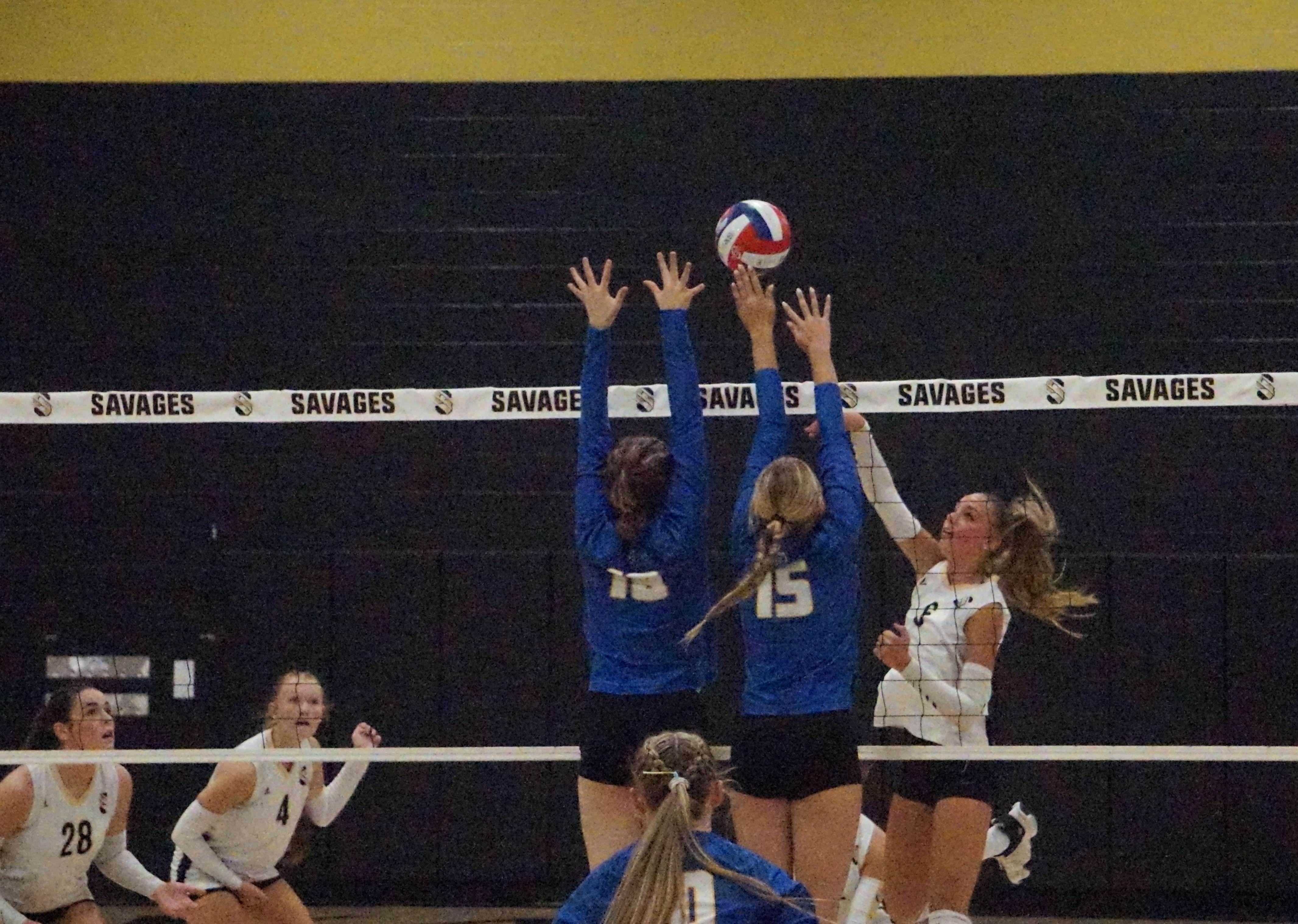 Savannah's Rilynn Blake against East Buchanan's wall of Brittyn Sharp (15) and Lana Spicer (18)/ Photo by Matt Pike