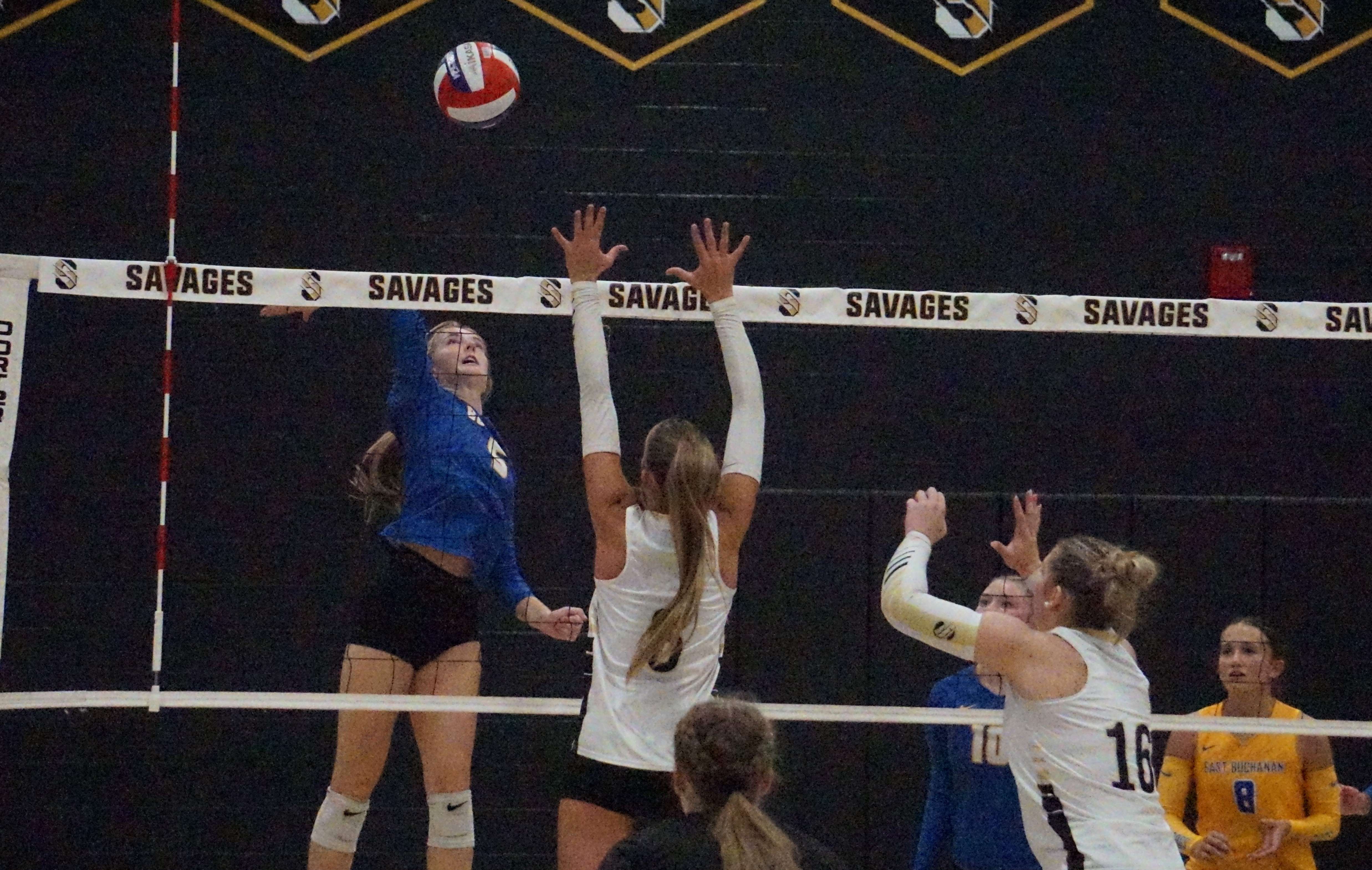 East Buchanan's Kamryn Werle (5) goes up against Savannah's Rilynn Blake (6).