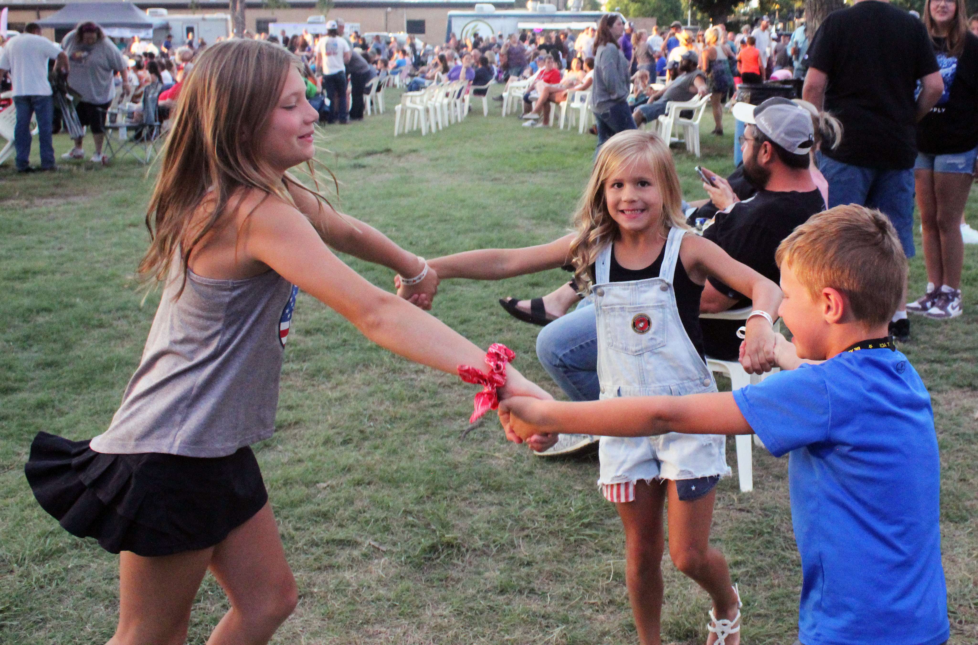 Children dance in the crowd at the Wild West Festival. Photo by Cristina Janney/Hays Post