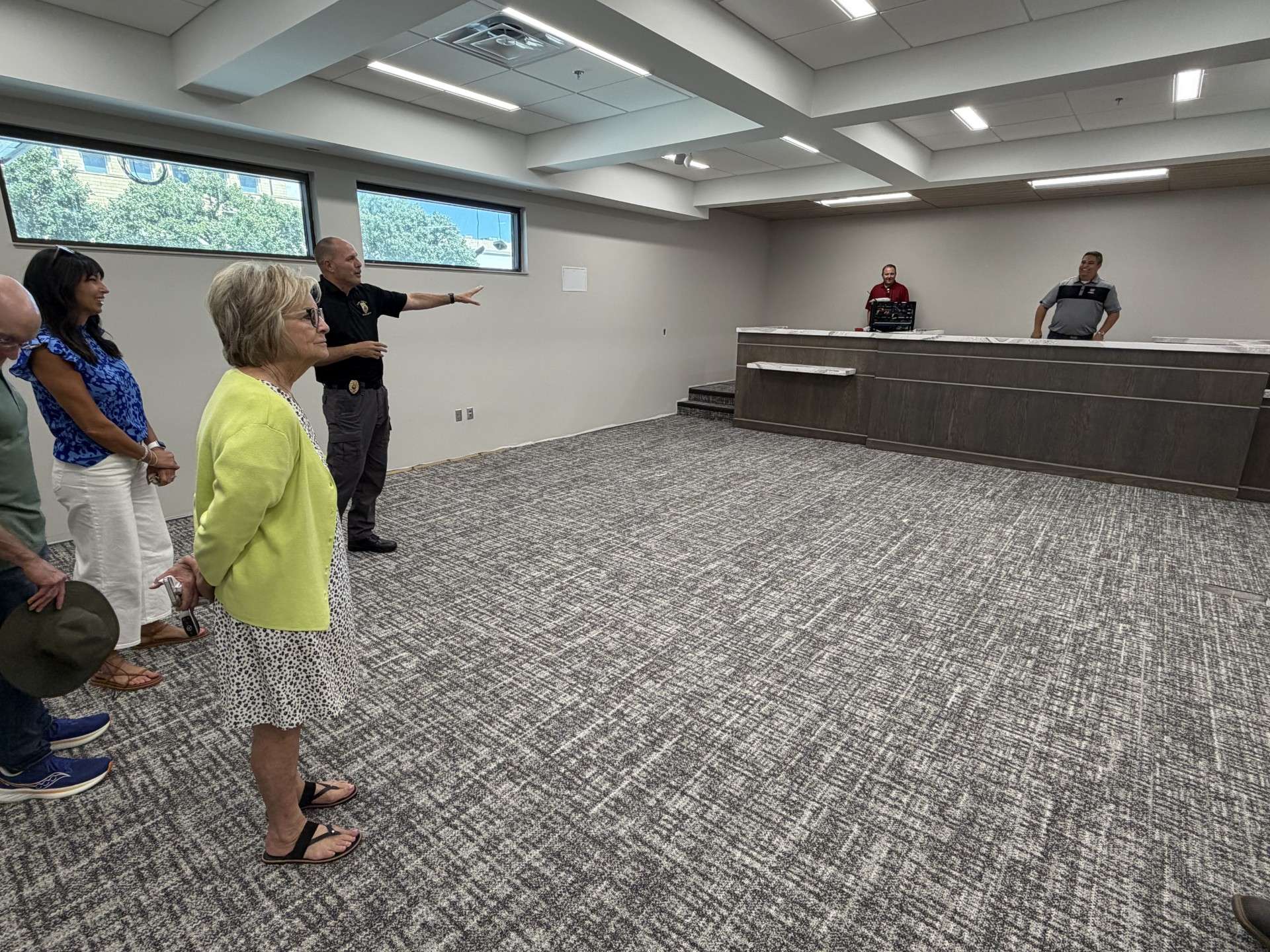 Don Scheibler, police chief, shows the new municipal court room to Alaina Cunningham, vice-mayor; Sandy Jacobs, city commissioner (left); Collin Bielser, deputy city manager; and Mason Ruder, mayor (right).&nbsp;Photo by Becky Kiser/Hays Post