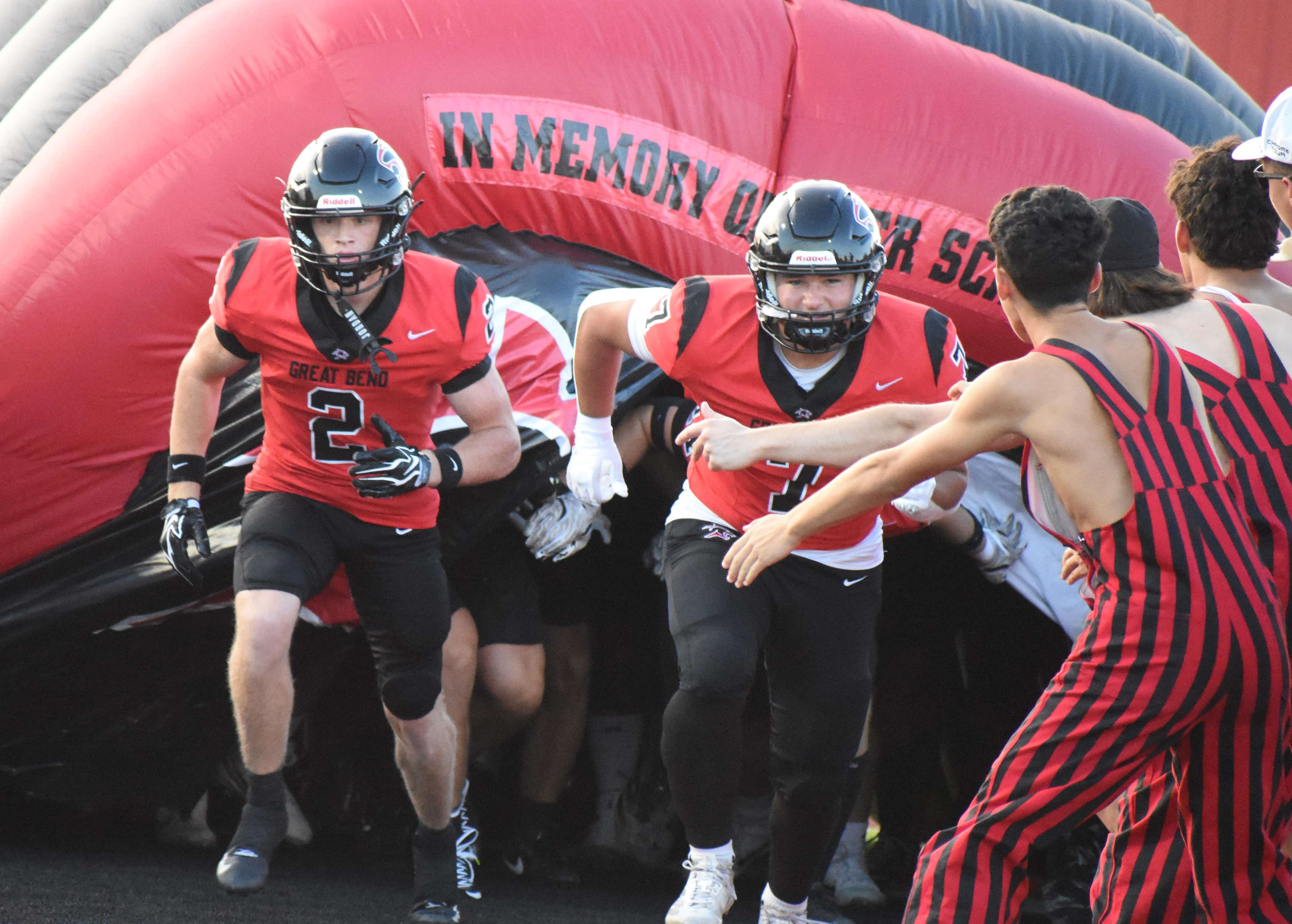 Great Bend seniors Cooper Ohnmacht and Kale Kern lead the Panthers out of the Ryder Schmidt Memorial Tunnel prior to Friday's season opener against Scott City. (photo by Mike Courson)