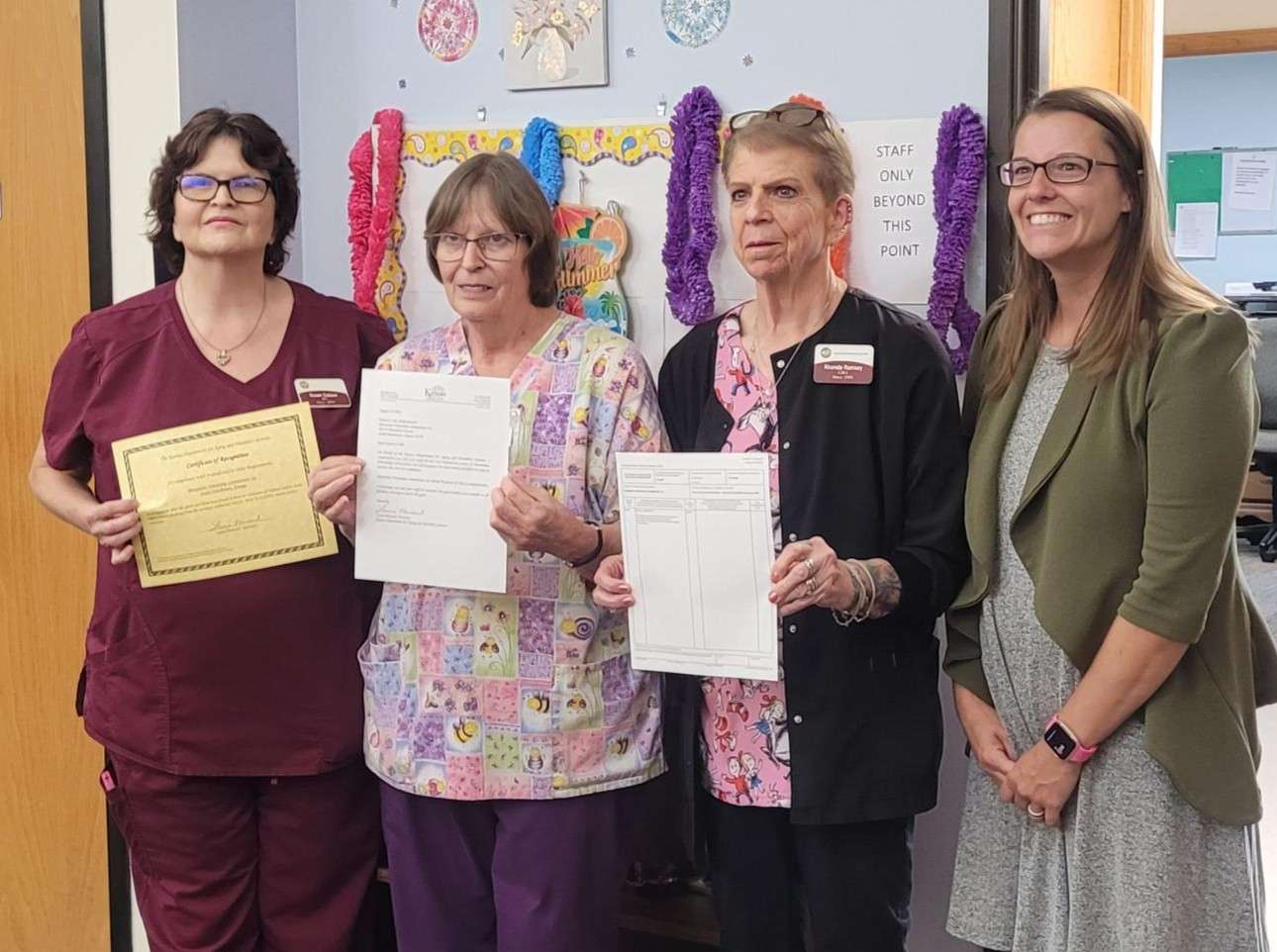 Susan Colson, MFC Assisted Living Nurse Manager, Delores Enslinger, Assisted Living CMA, Rhonda Ramsey, Assisted Living CMA, and Lacey Hunger, Commissioner of Survey, Certification and Credentialing Commission (Photo courtesy Mennonite Friendship Communities)