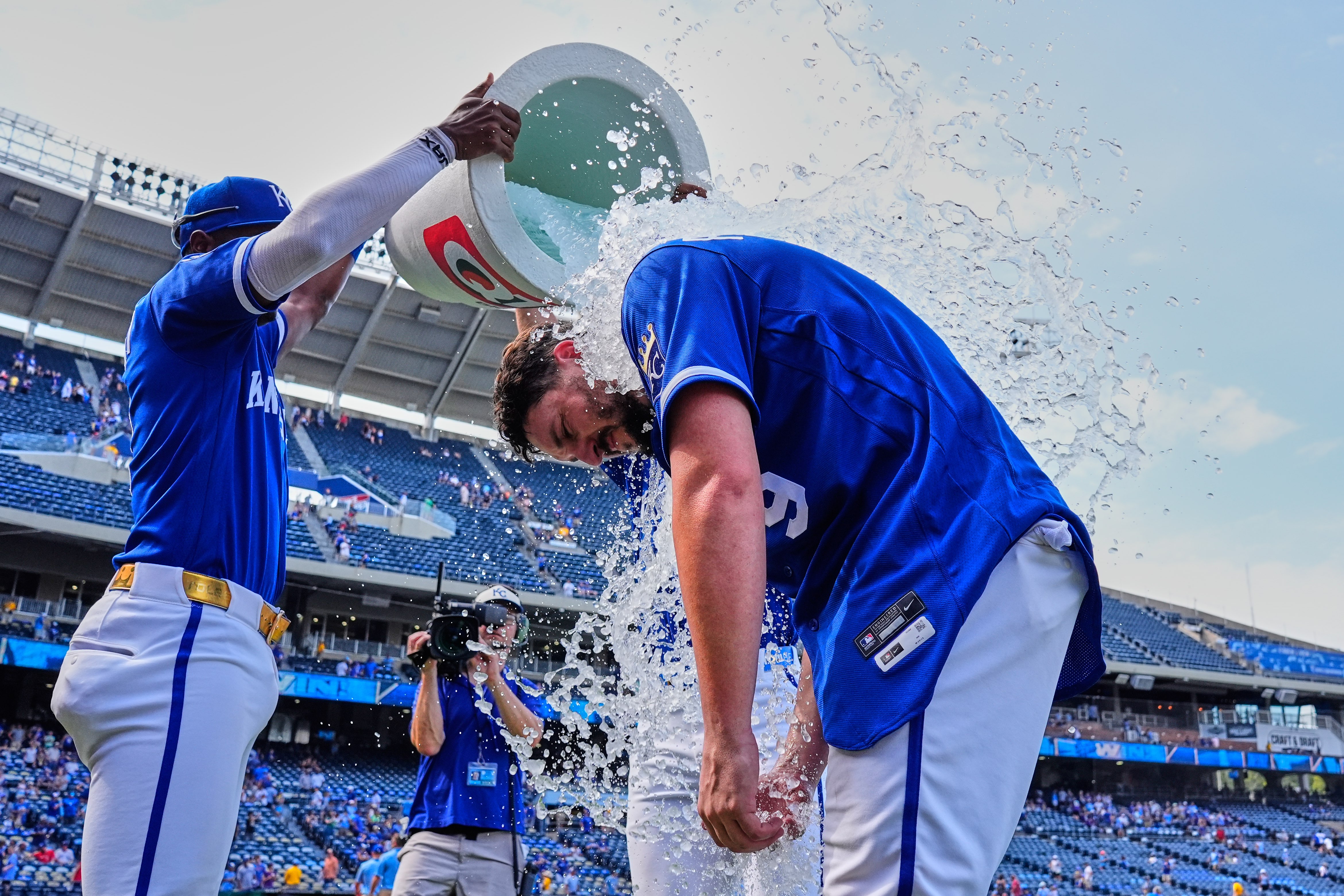Kansas City Royals' Vinnie Pasquantino (9) is doused by teammates after their baseball game against the Toronto Blue Jays, Sunday, Sept. 6, 2026, in Kansas City, Mo. (AP Photo/Charlie Riedel)