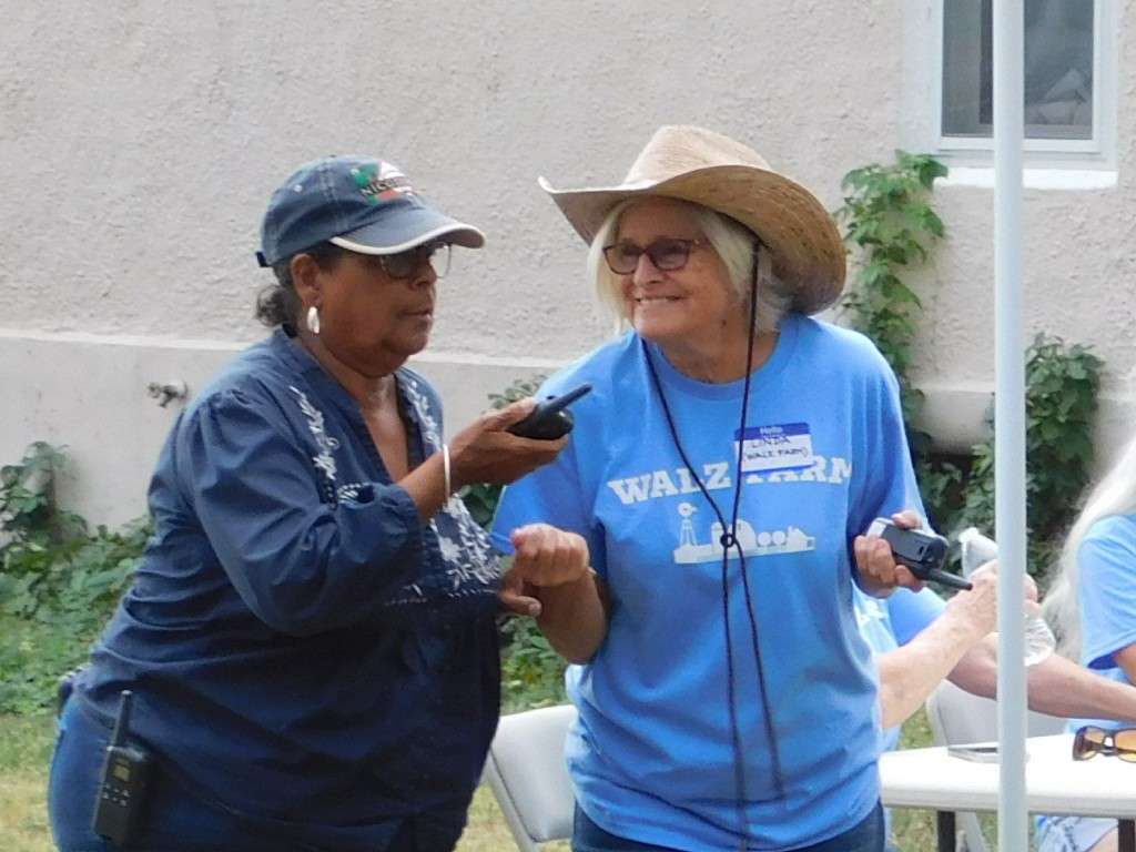 Angela Bates with a representative of Walz Farm. Photo by Karen Madorin
